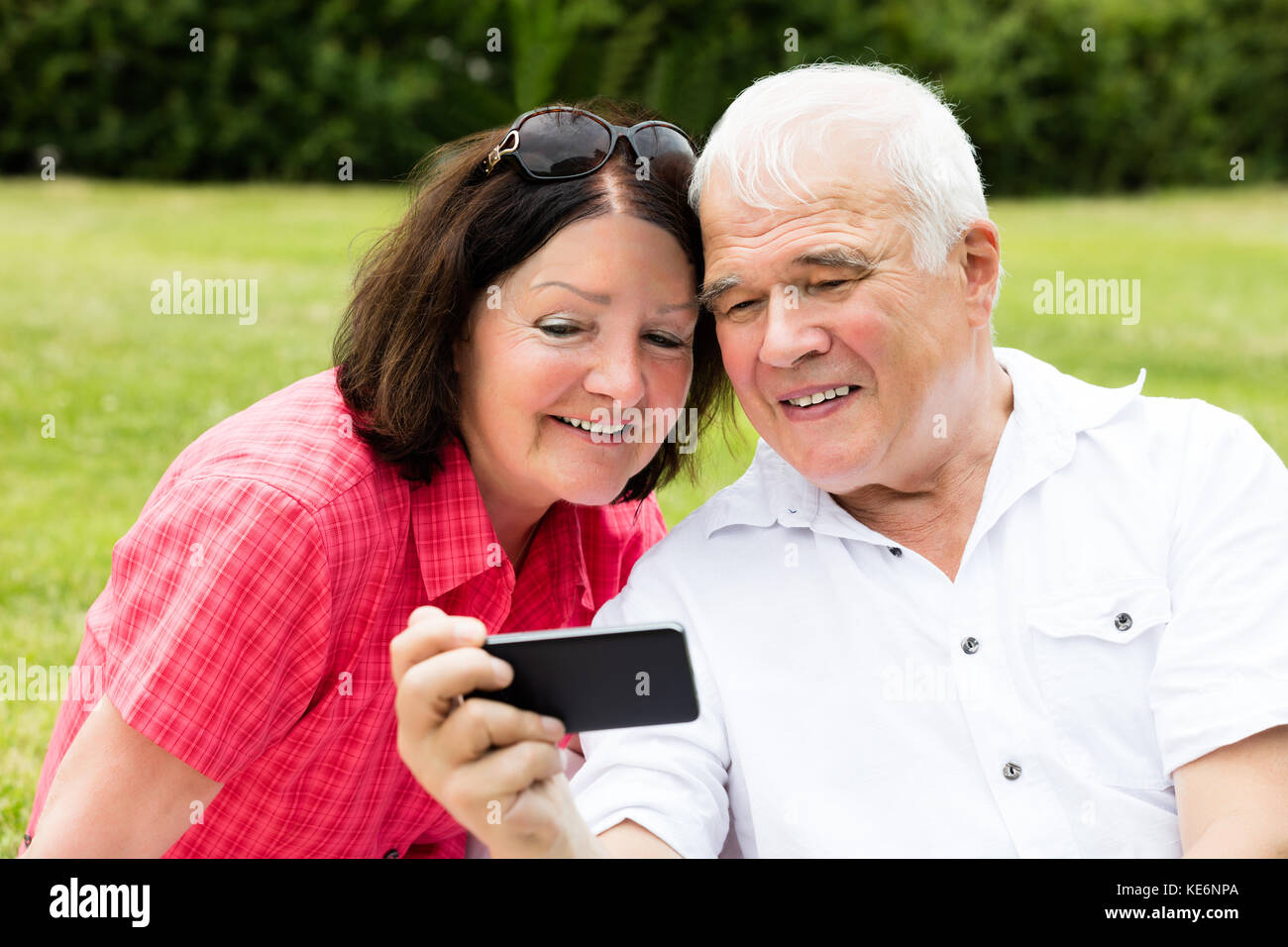 Happy Senior Couple Taking Selfie With Mobile Phone Stock Photo - Alamy