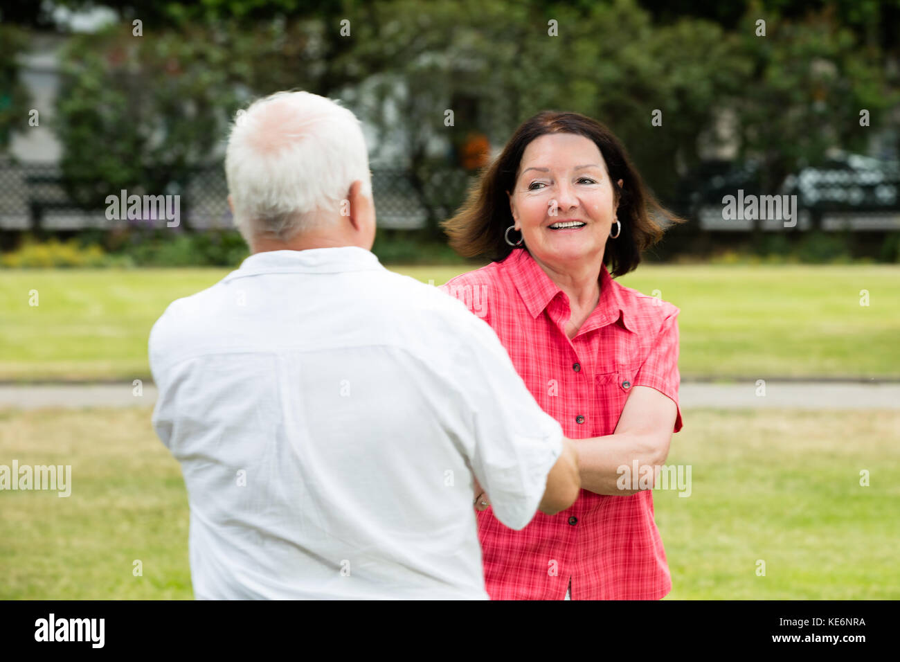 Smiling Senior Couple Having Fun In Park Stock Photo - Alamy