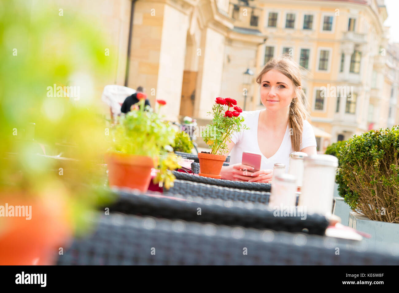 Young woman in street cafe Stock Photo - Alamy