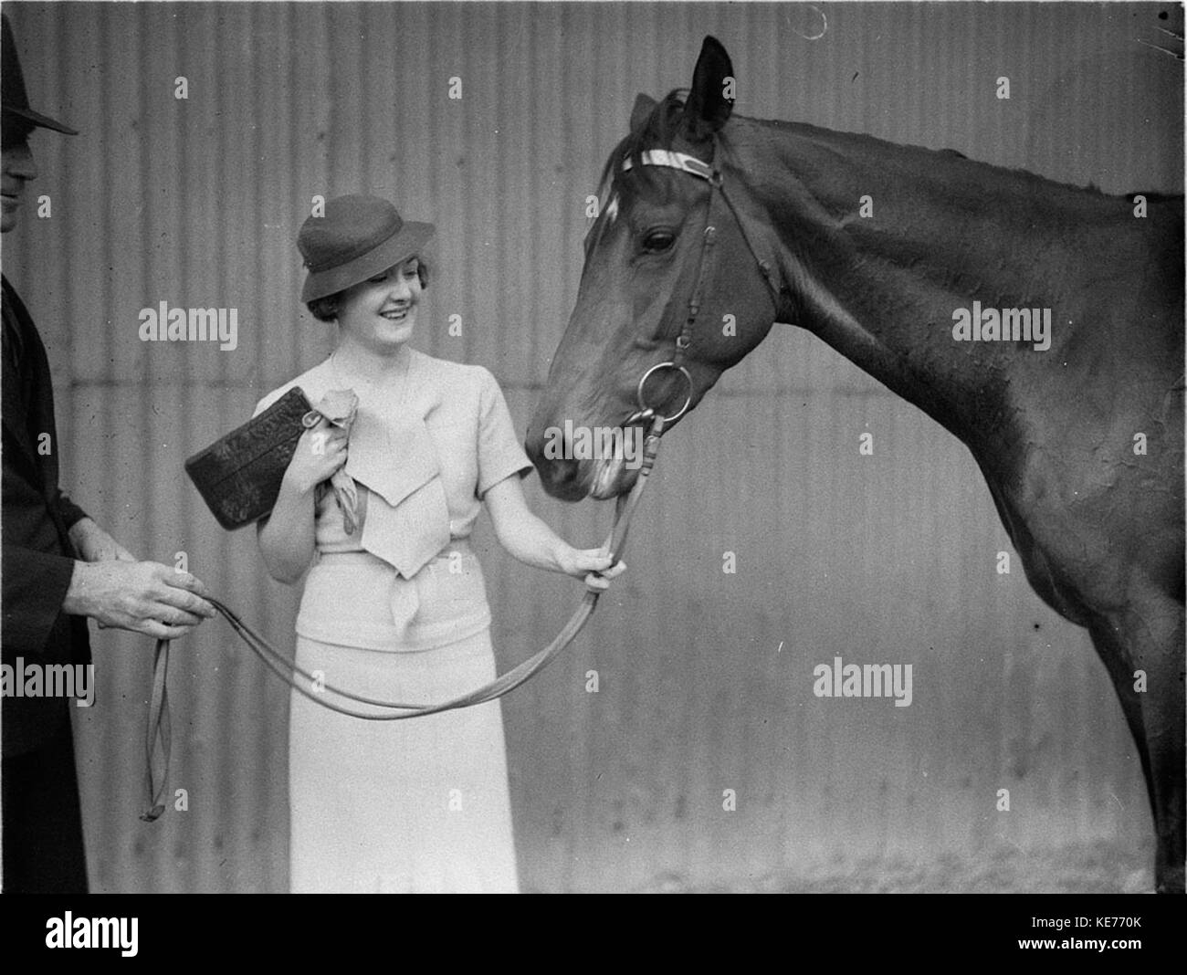 7230 A woman owner with her winning horse Stock Photo