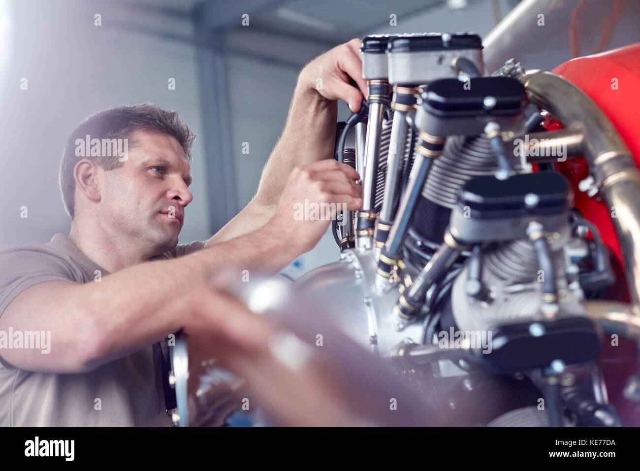 Male airplane mechanic repairing propellor Stock Photo