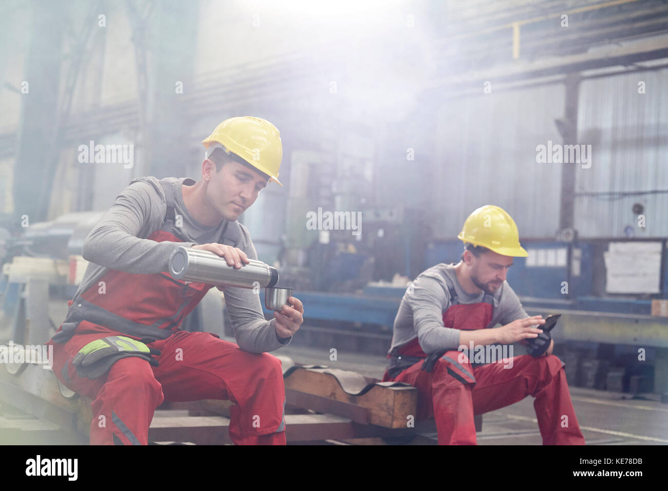 Factory workers taking coffee break Stock Photo