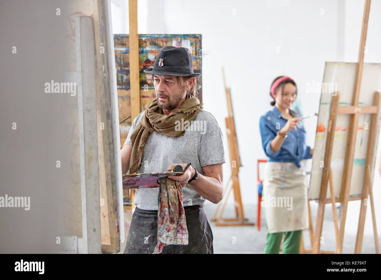 Artists painting in art class studio Stock Photo