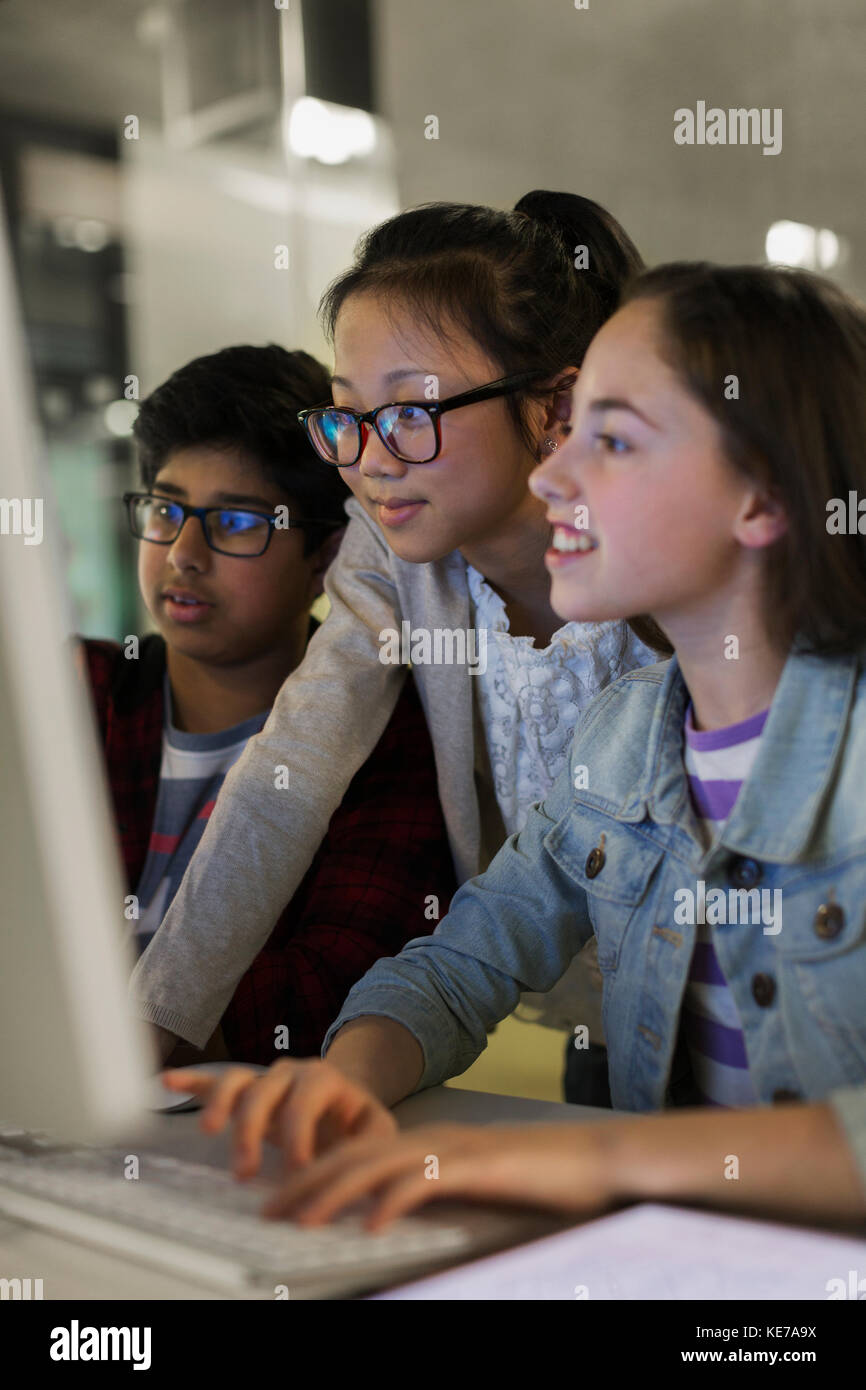 Students using computer in classroom Stock Photo