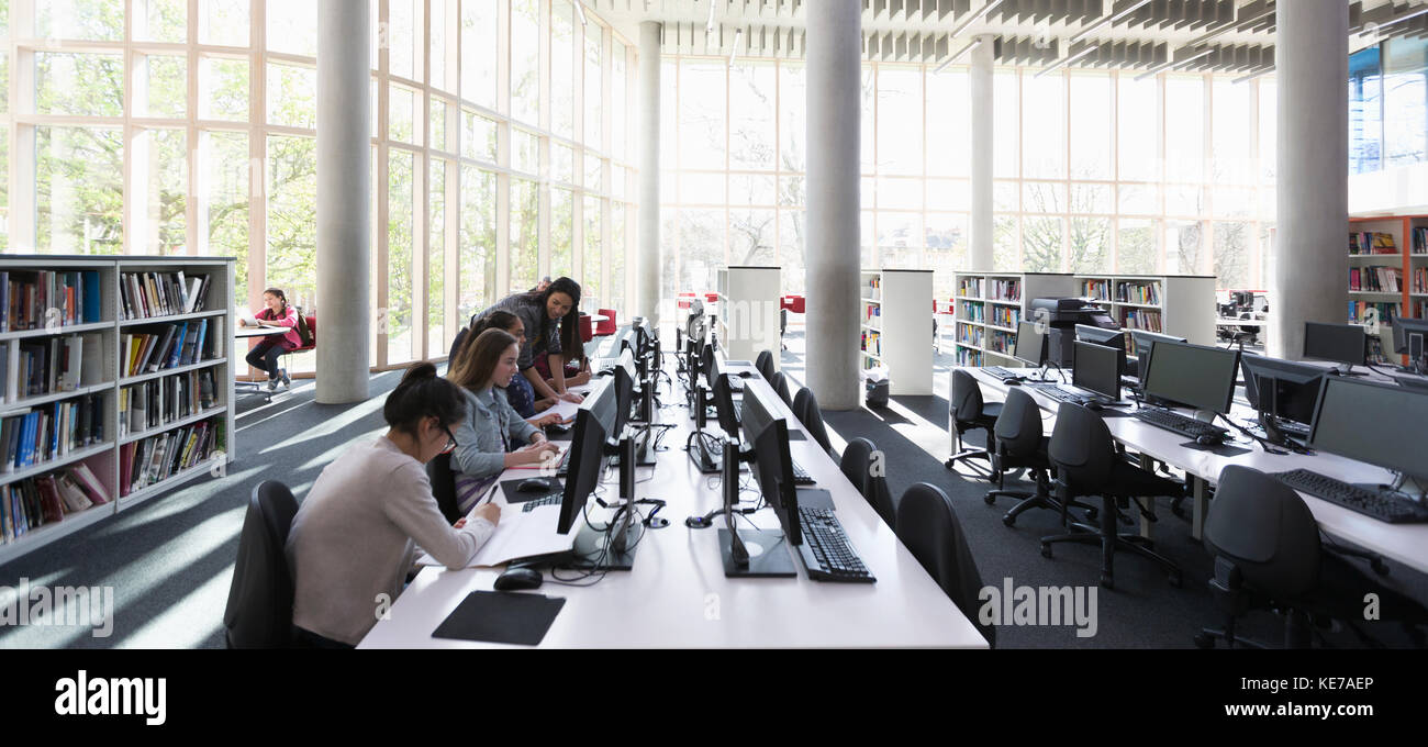 Students researching at computers in library Stock Photo - Alamy