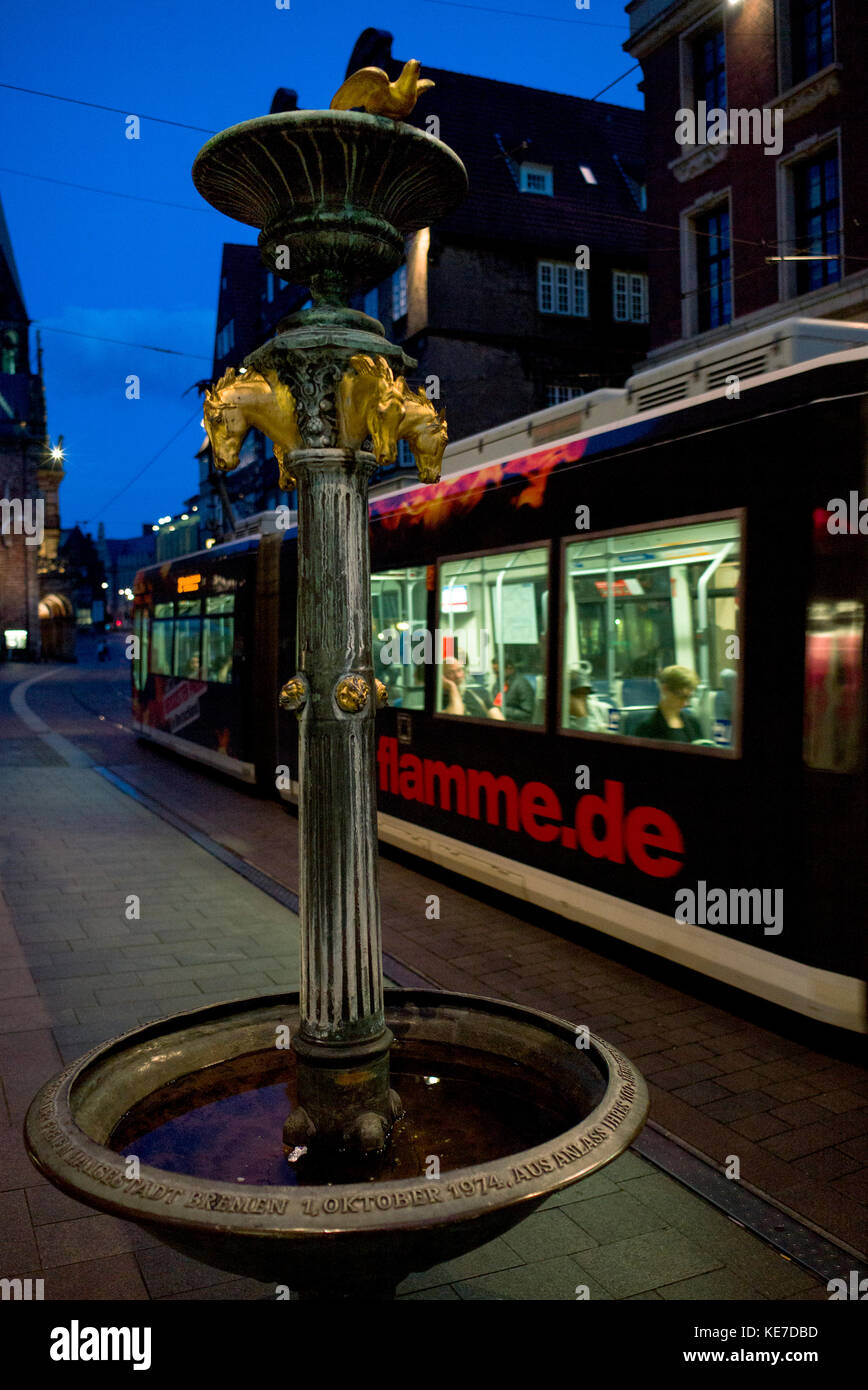 Tram passing horse water fountain on the market square, Bremen, Stock Photo