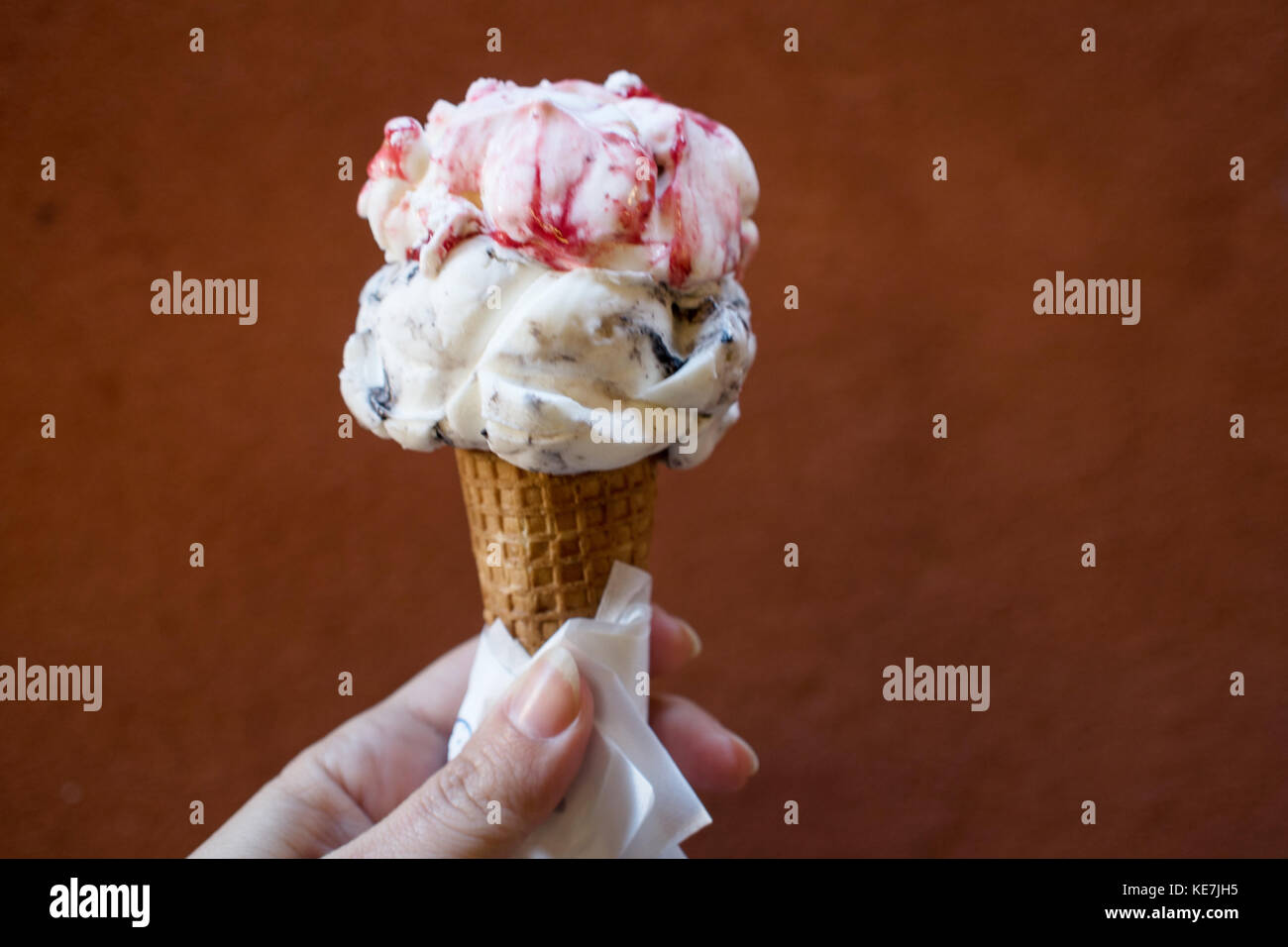 Gelato. Italian ice cream in a waffle cone, to hold Stock Photo
