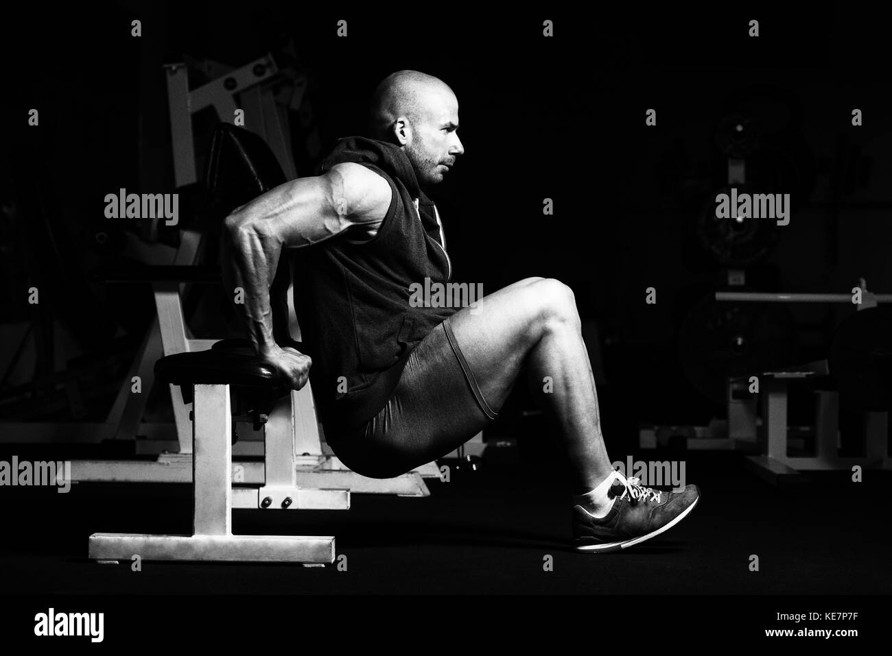 Strong Man In The Gym Exercising Triceps On Bench Muscular
