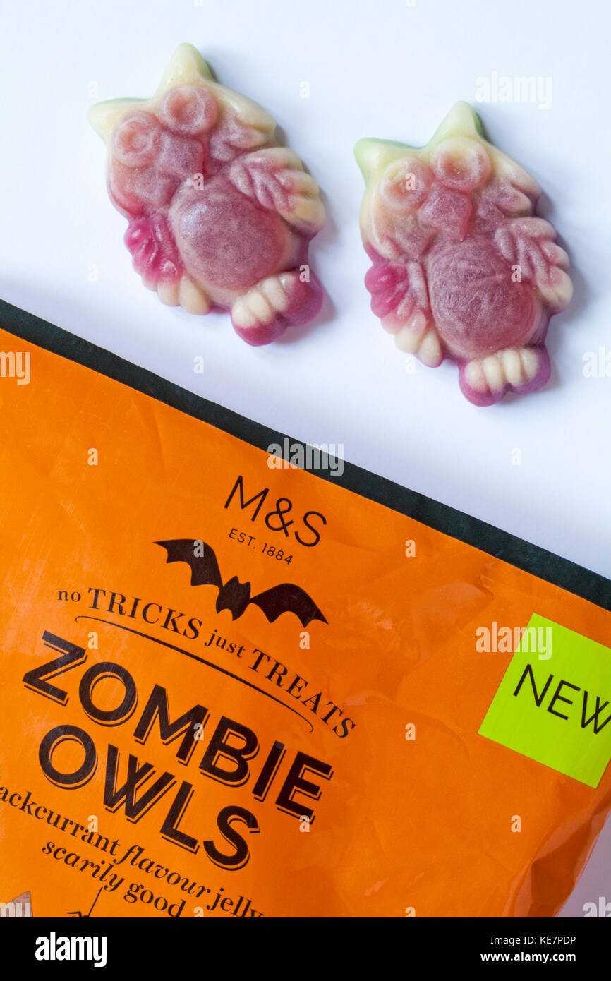 Packet of M&S Zombie Owls lime & blackcurrant flavour jelly sweets scarily good - no tricks just treats for Halloween open to show contents Stock Photo