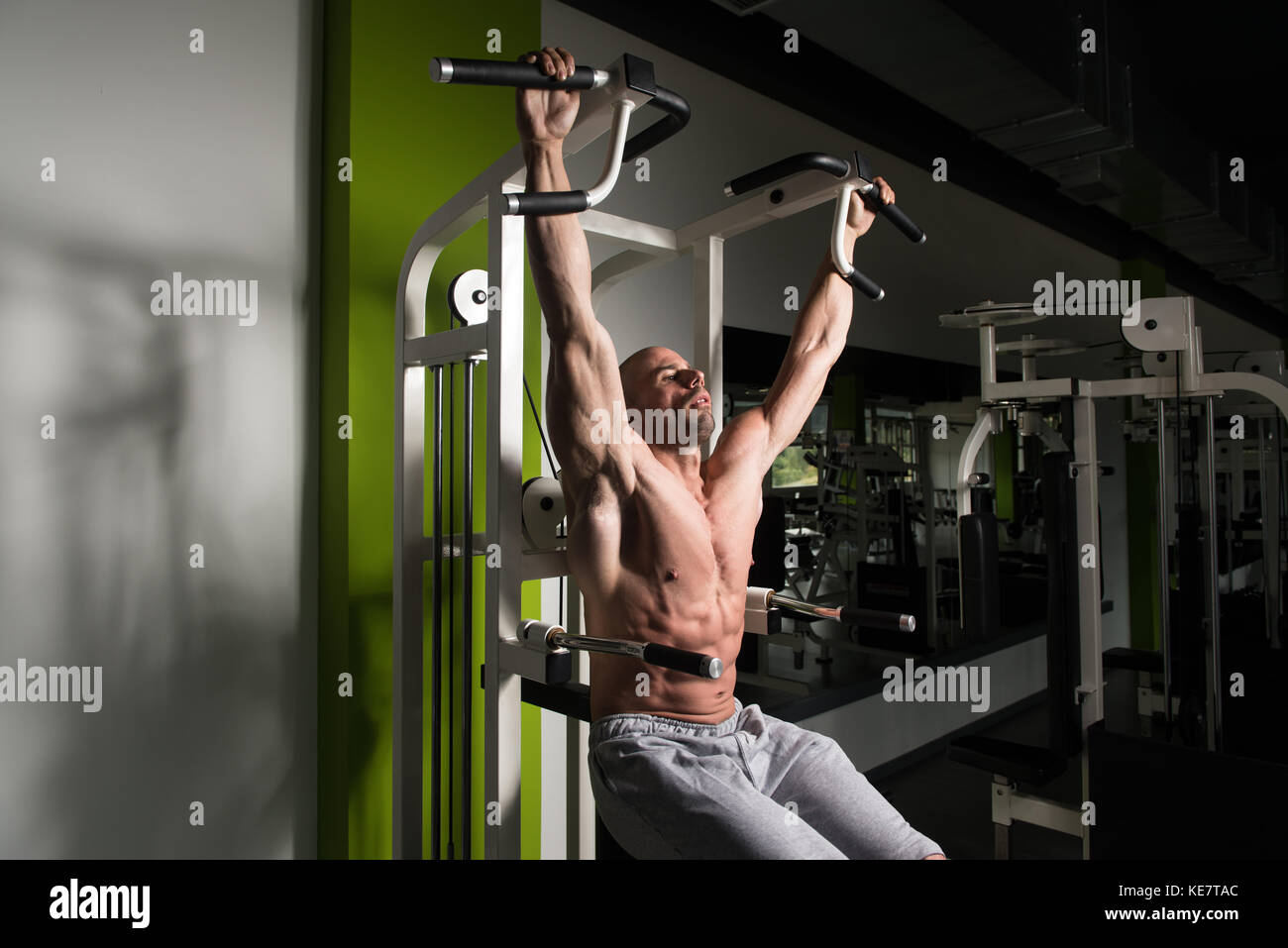 Man Performing Hanging Leg Raises Exercise One Of The Most Effective