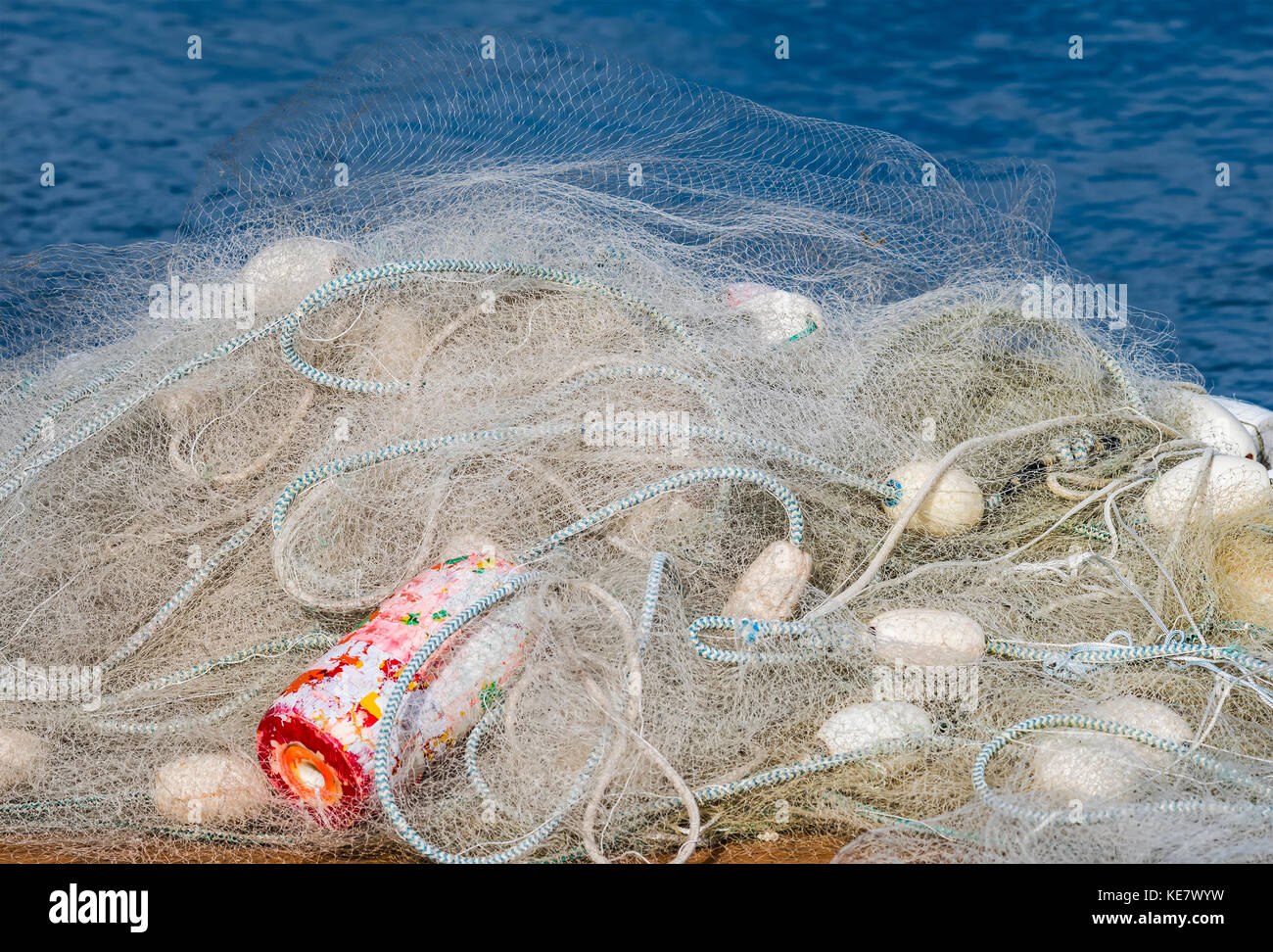 A Fishing Net Is Piled On A Dock; Astoria, Oregon, United States