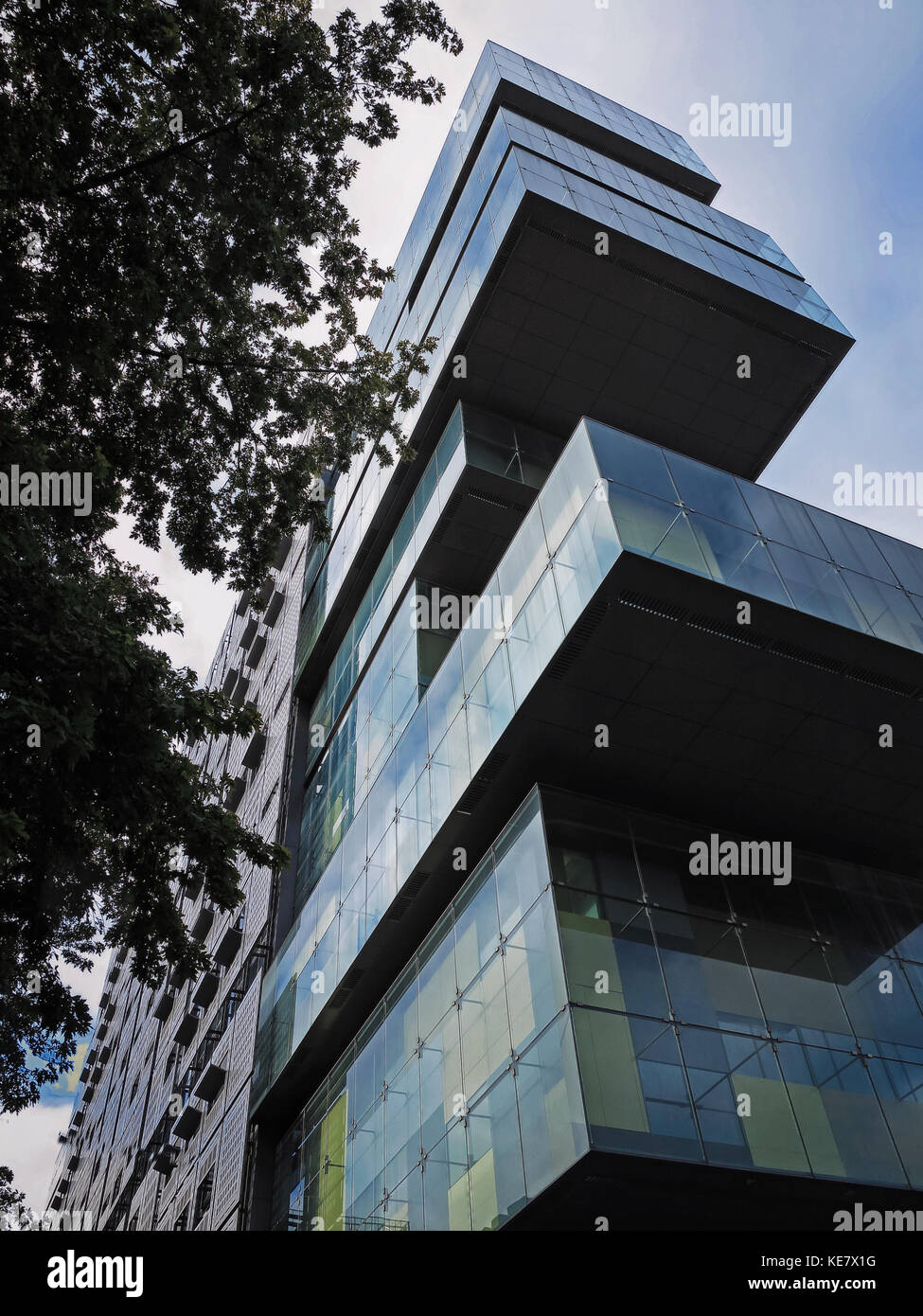 Looking up at the Manchester Civil Justice Centre, a modern tiered building at Spinningfields, Manchester Stock Photo