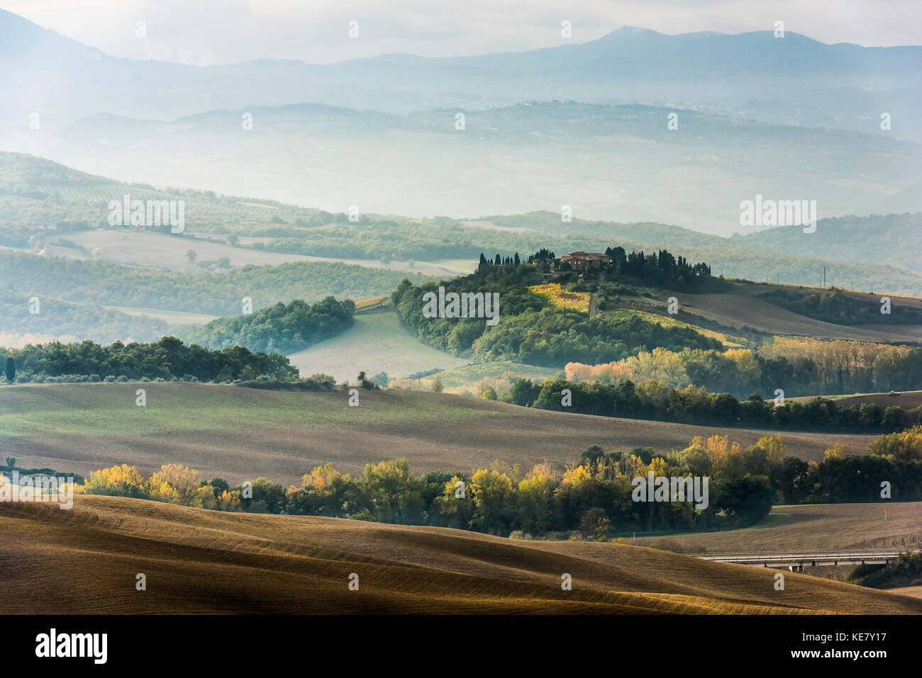 Layers Of Green And Gray Tuscany Hills Disappearing In The Mist; San Quirico D'orcia, Tuscany, Italy Stock Photo