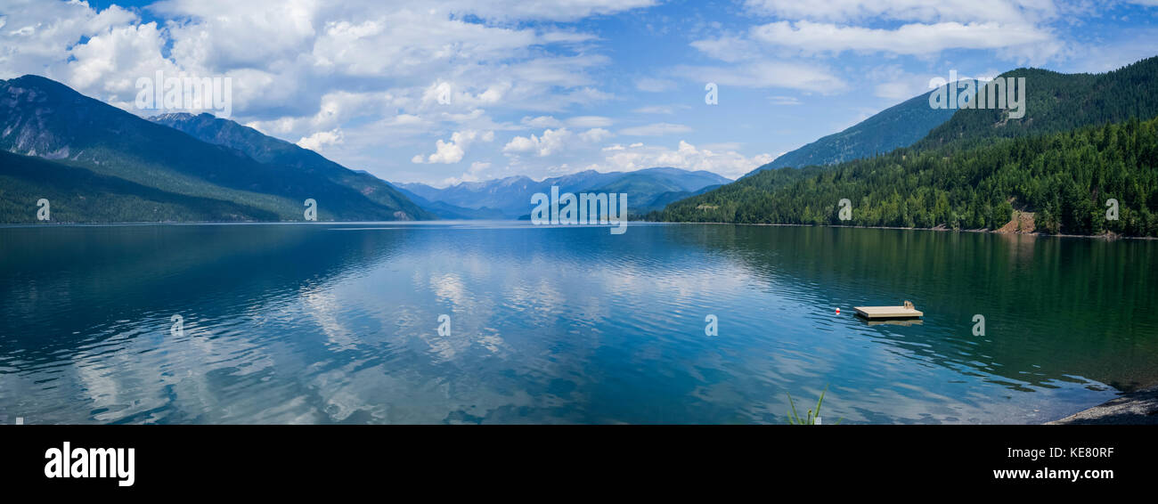 A wooden dock floating in Kootenay Lake in the Selkirk Mountains; Nelson, British Columbia, Canada Stock Photo