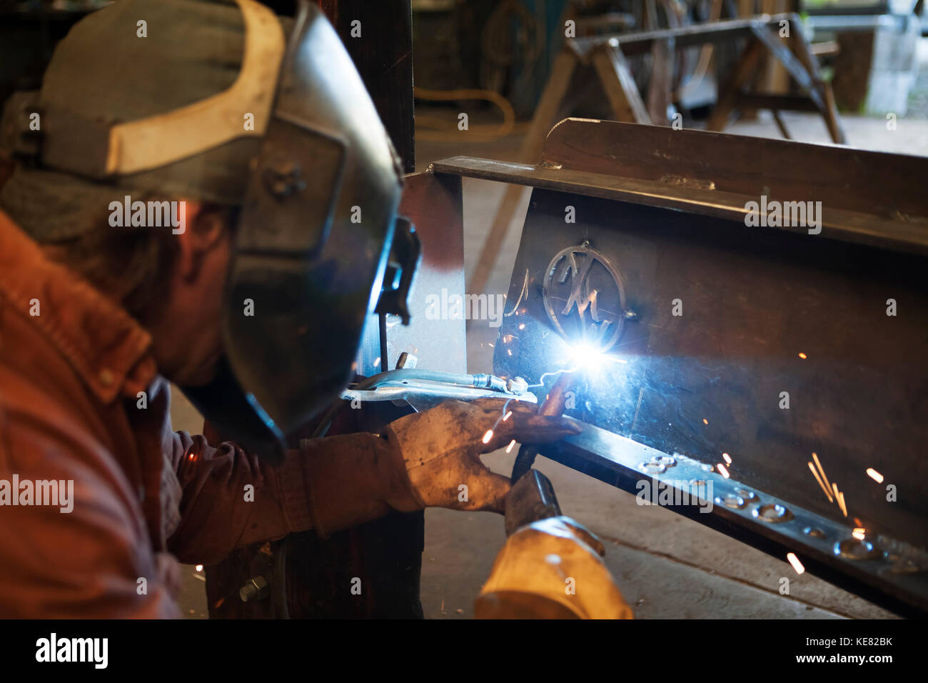 Welder And Metal Work Artist Doug Schwiesow Working On A Custom Sign