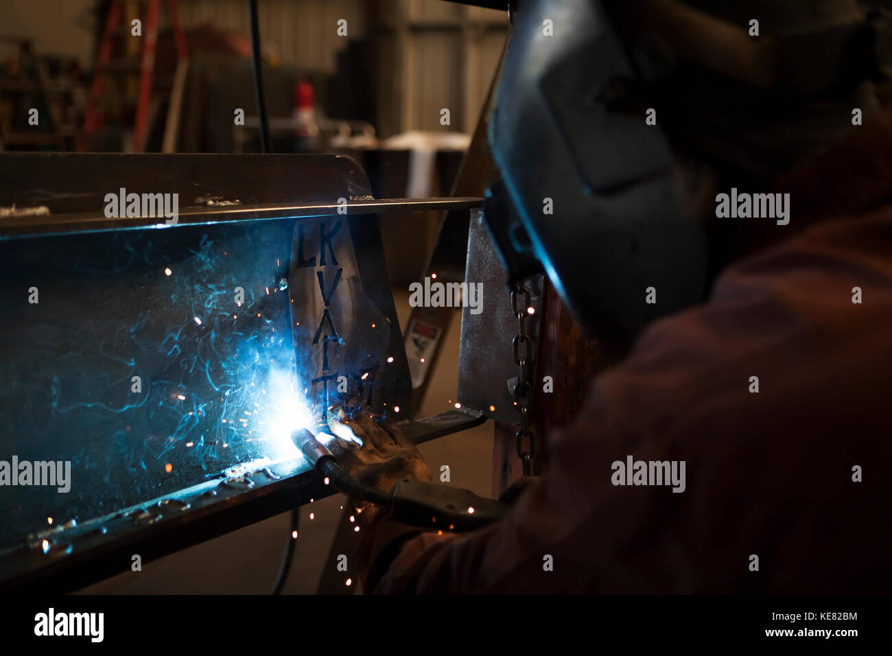 Welder And Metal Work Artist Doug Schwiesow Working On A Custom Sign