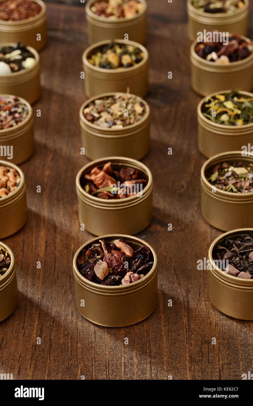 rows of organic herbal tea in tins Stock Photo