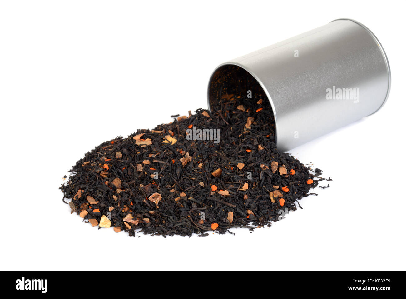 spilled chai tea with pumpkin and tin Stock Photo