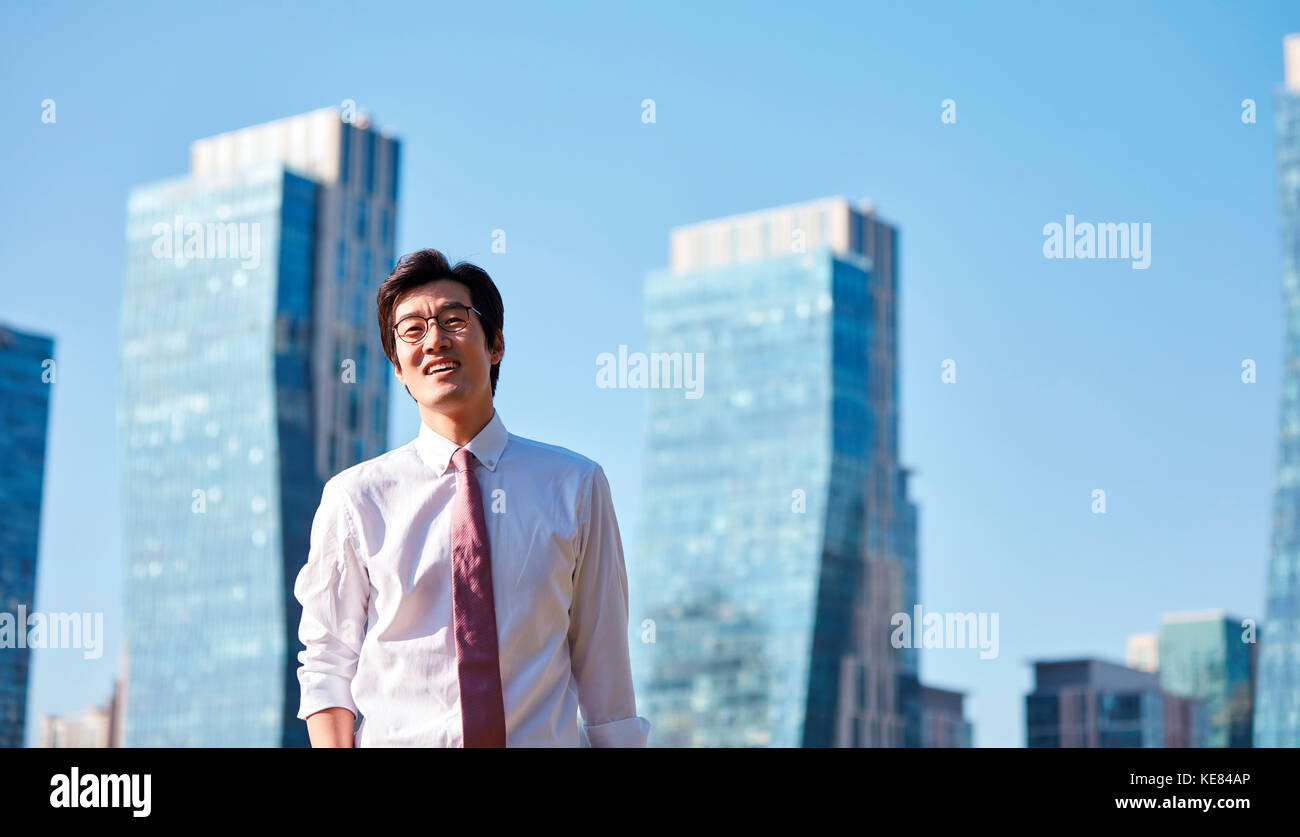 Smiling businessman outdoors during daytime Stock Photo - Alamy