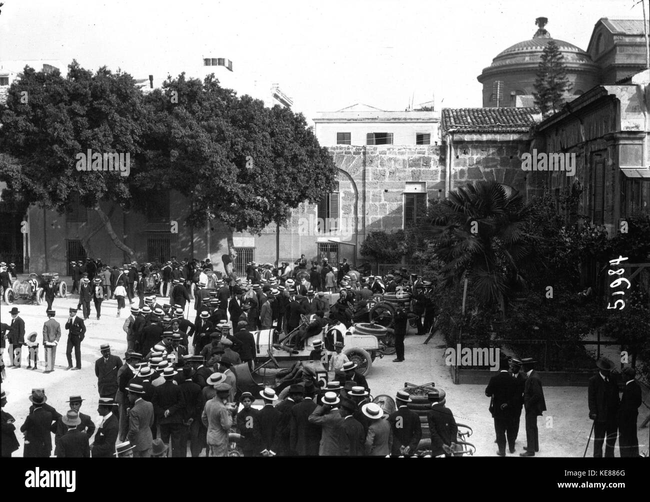 The 1914 Targa Florio, an Italian motorsport event, featured a variety of early 20th-century cars racing across the Sicilian roads. This photo captures some of the cars participating in the race, a key moment in racing history. Stock Photo