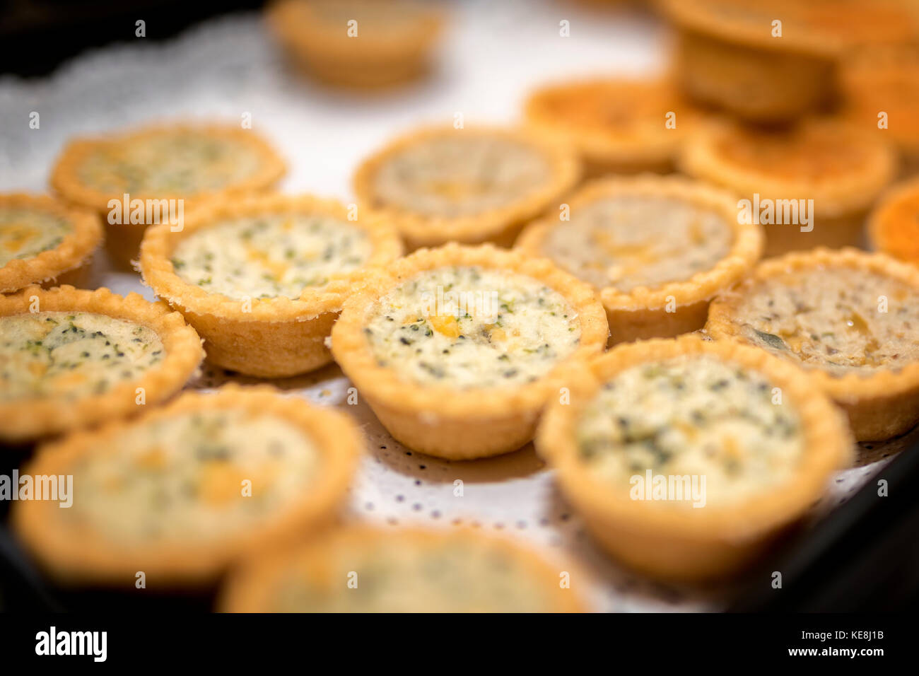 Close up of delicious crusty mini quiche lorriane tarts at a buffet at a tradition England wedding in the UK Stock Photo