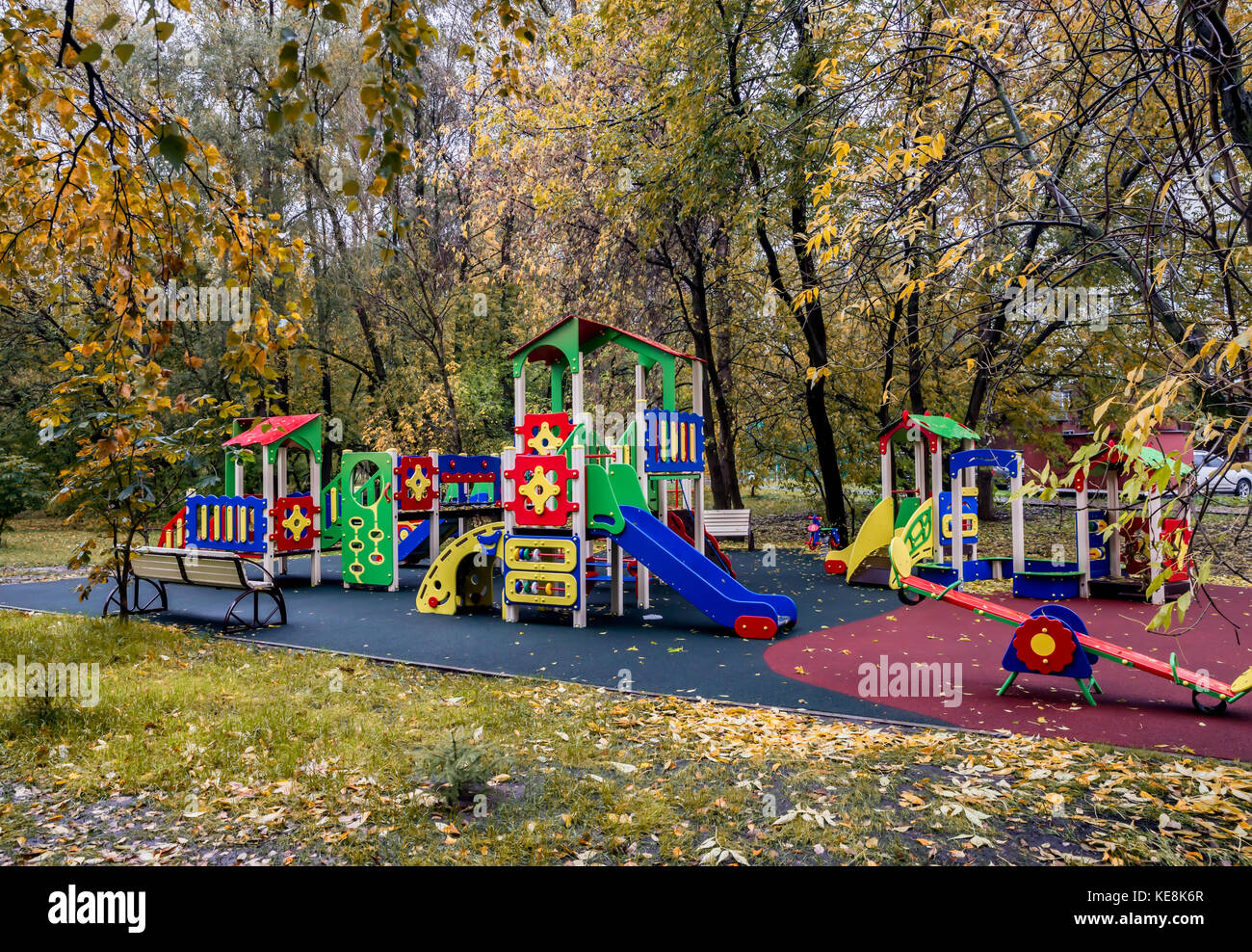 Empty children's playground in a park in autumn. Children are adult. Children are at school. The concept of city improvement, taking care of children, Stock Photo