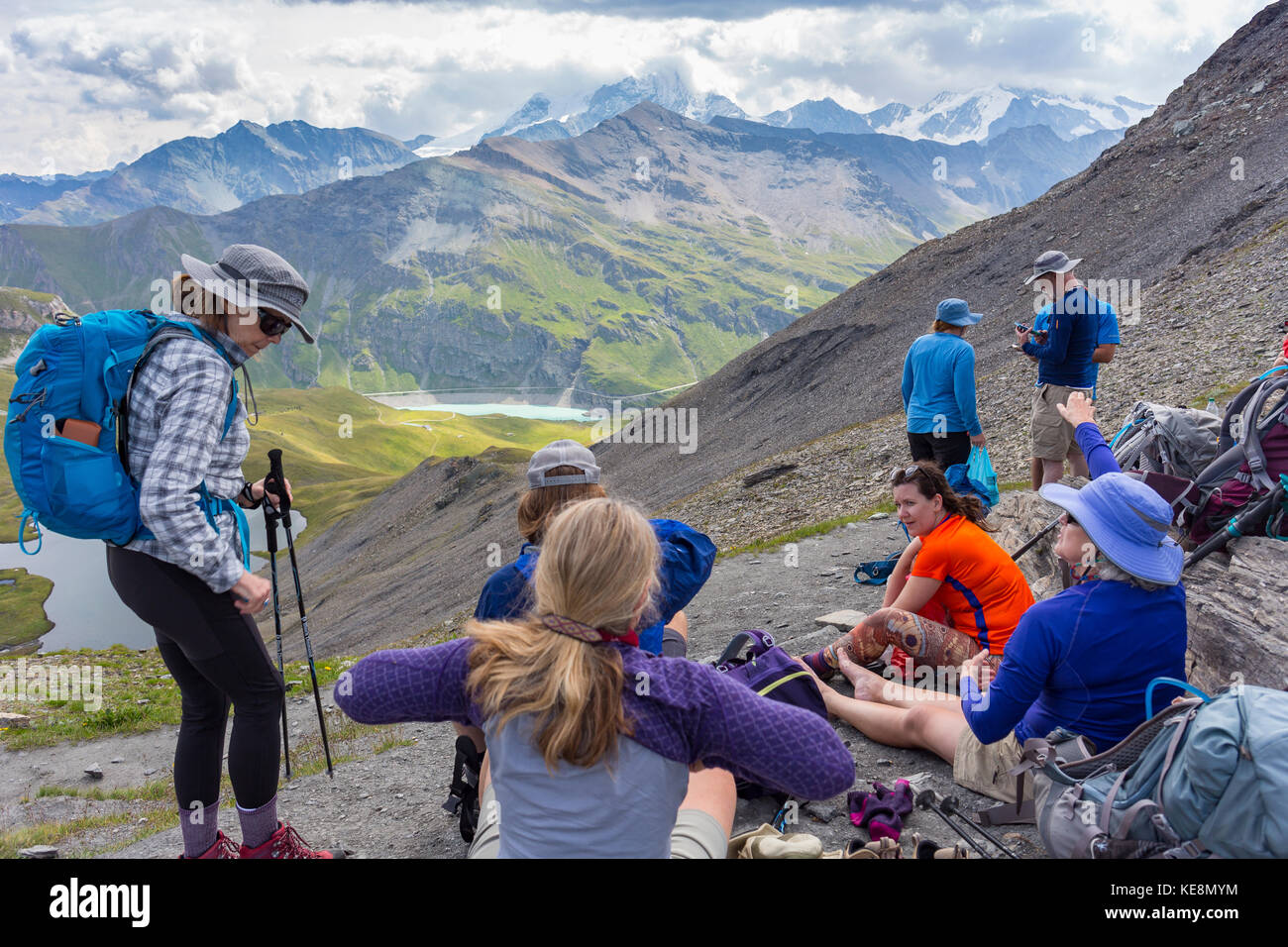 MOIRY VALLEY, SWITZERLAND -  Hikers on ridge, in the Pennine Alps in the canton of Valais. Stock Photo
