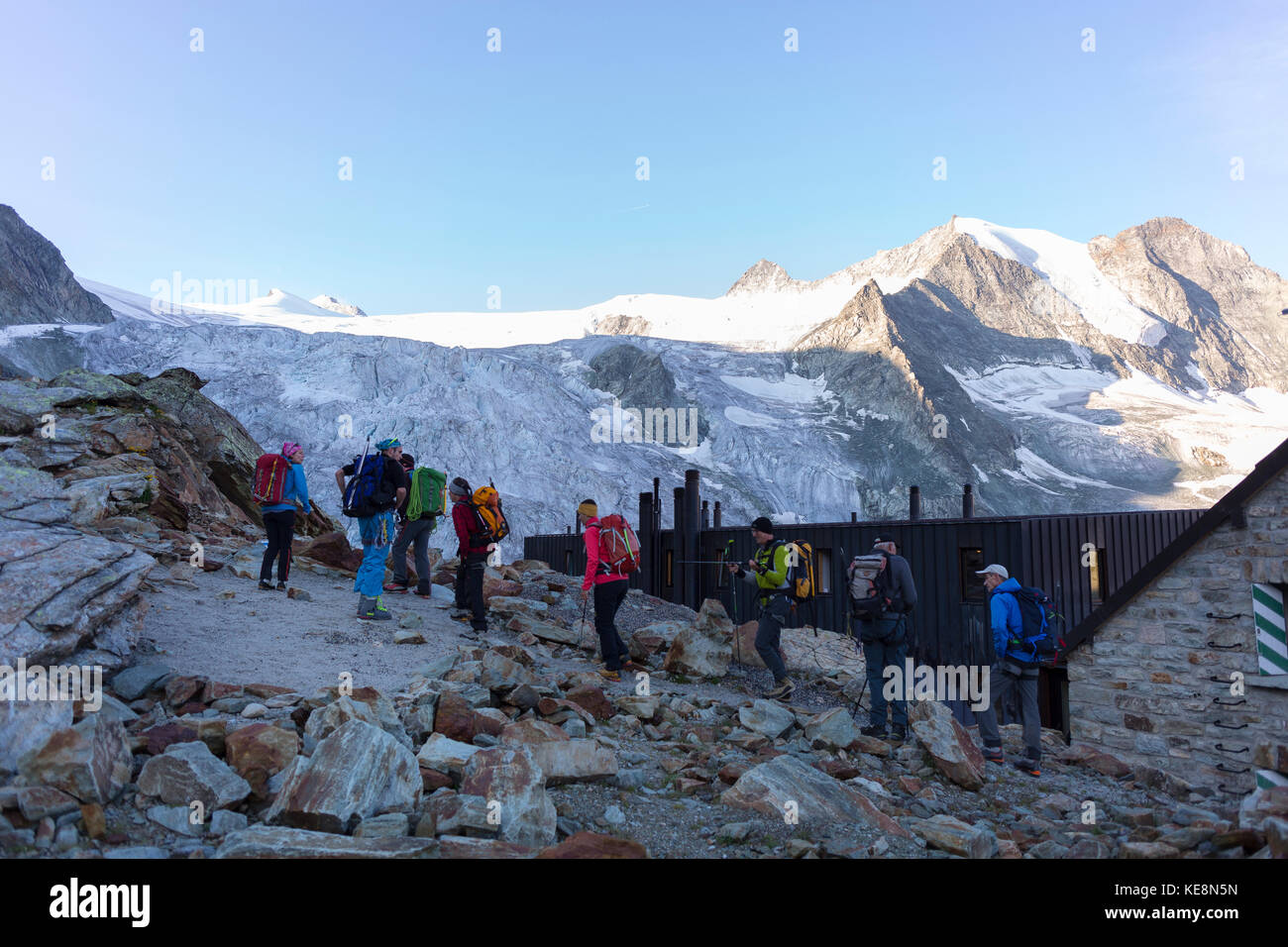 MOIRY VALLEY, SWITZERLAND - Climbers departing Cabane de Moiry, mountain hut, Moiry glacier, in the Pennine Alps in the canton of Valais. Stock Photo