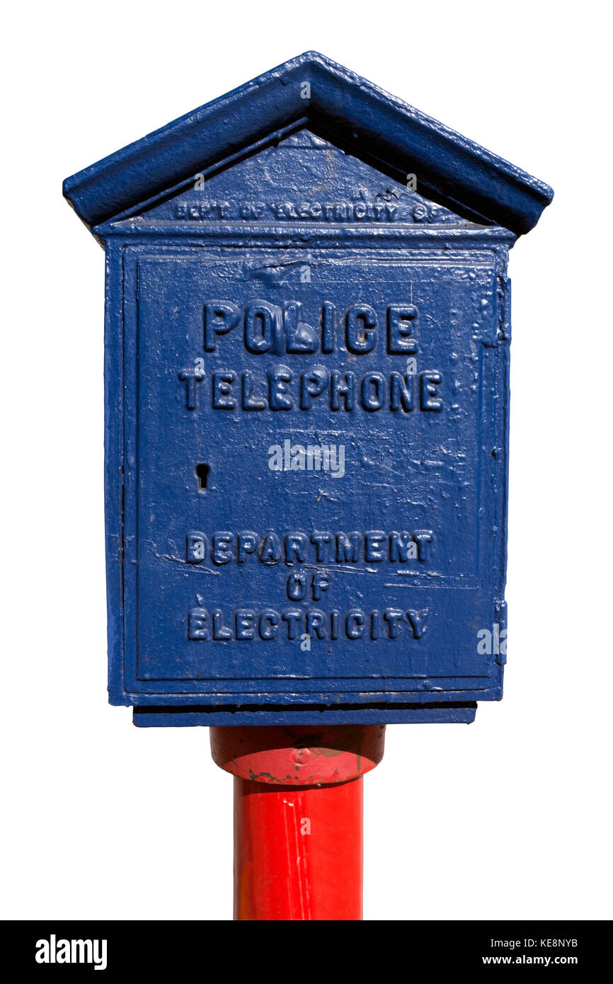 Vintage blue police call box on red pole. Isolated. Stock Photo