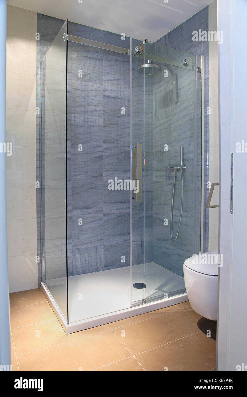 Modern shower with glass cabin inside bathroom interior Stock Photo Alamy