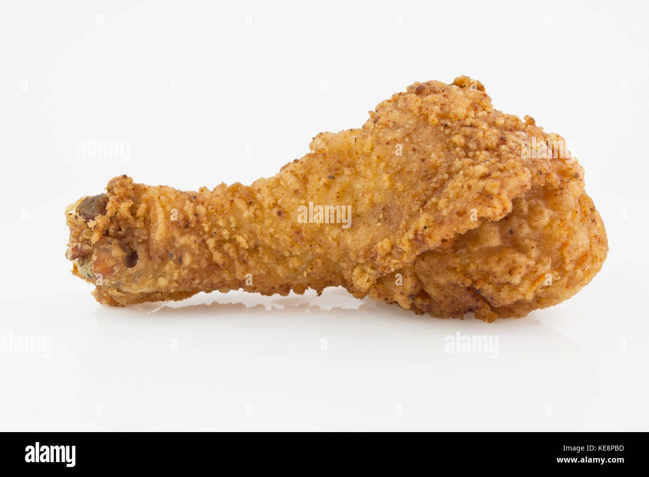 Homemade fried chicken drumstick on white background. Horizontal. Stock Photo