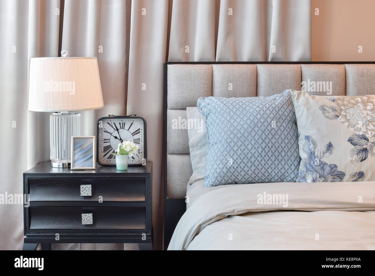elegant bedroom interior design with floral pattern pillows and ...