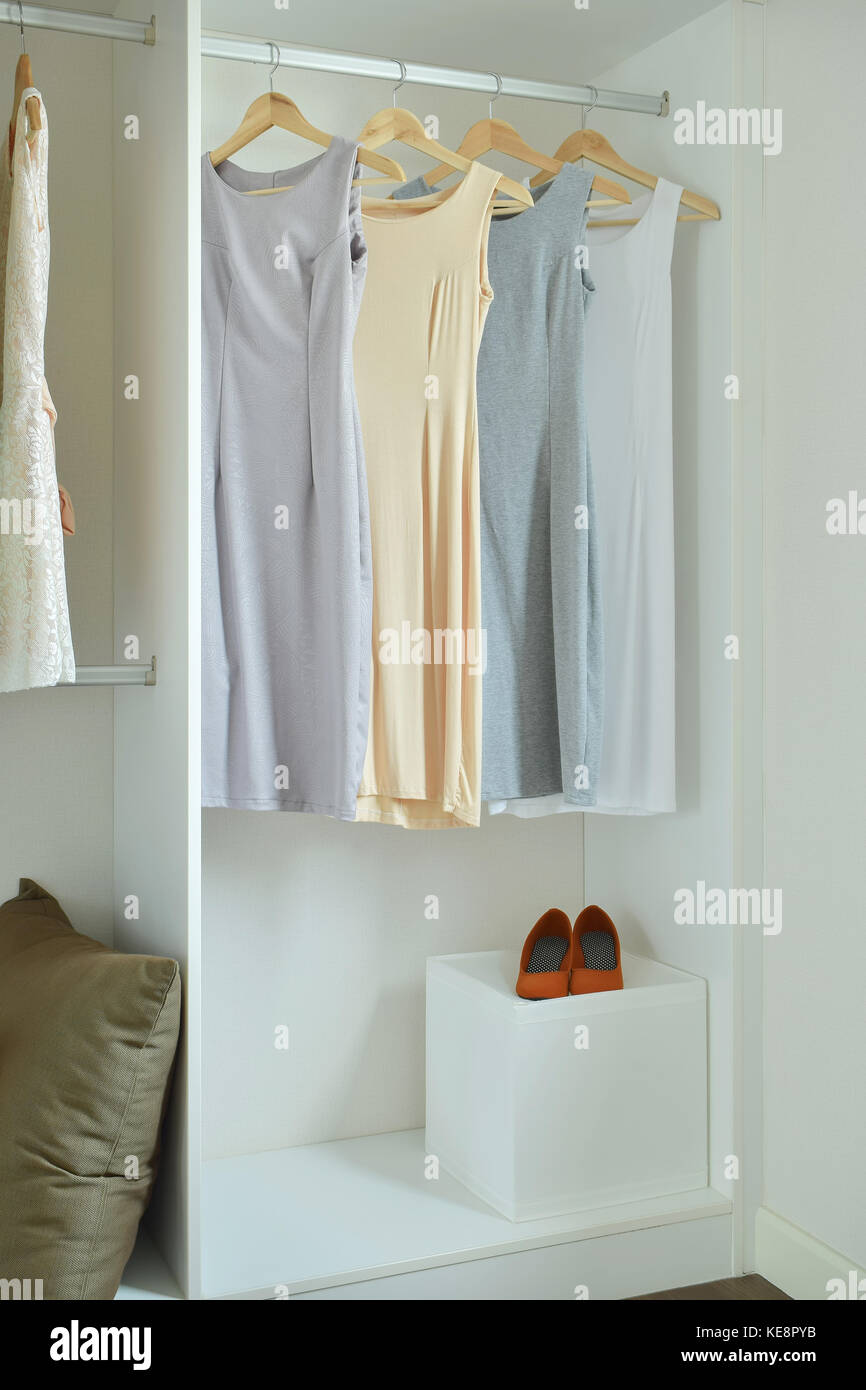 https://c8.alamy.com/comp/KE8PYB/female-clothes-on-hangers-in-wardrobe-KE8PYB.jpg