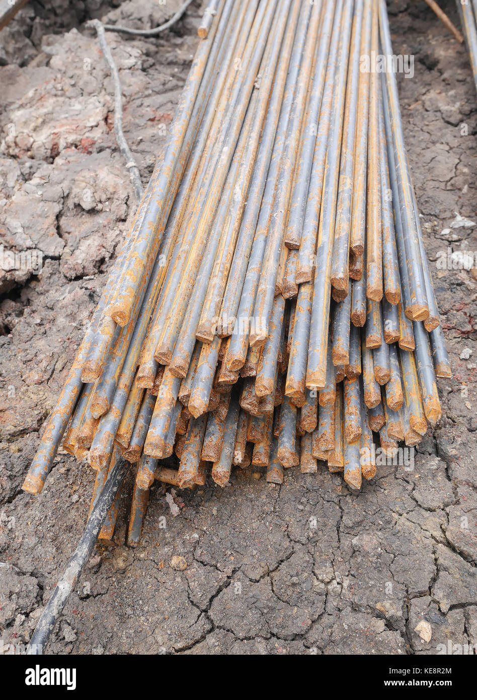 Steel rods or bars used to reinforce concrete in construction Stock
