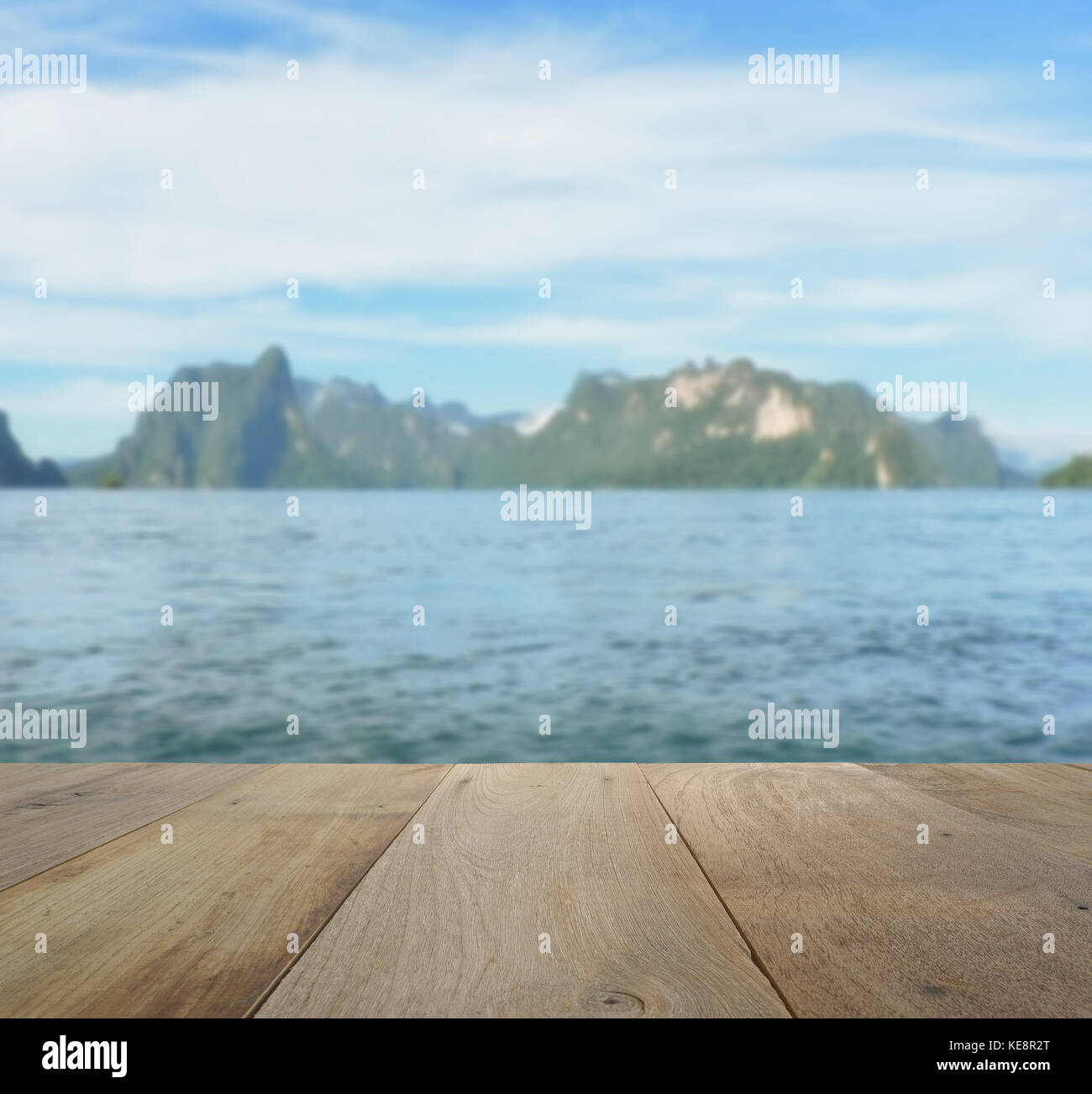 wood table top on blurred beautiful landscape with mountain and lake ...