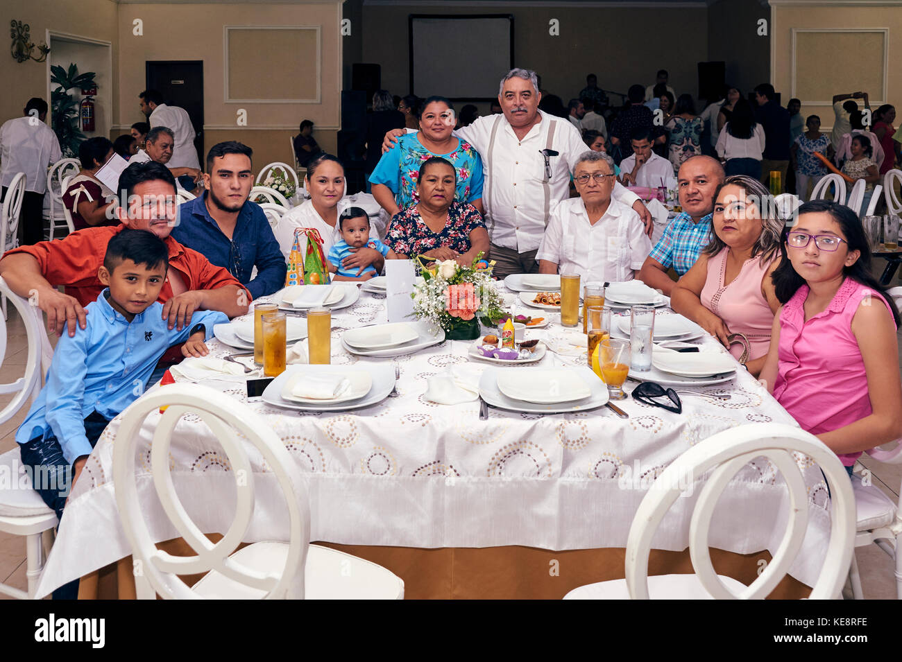 Large family during the reception party for a just baptised baby boy Stock Photo