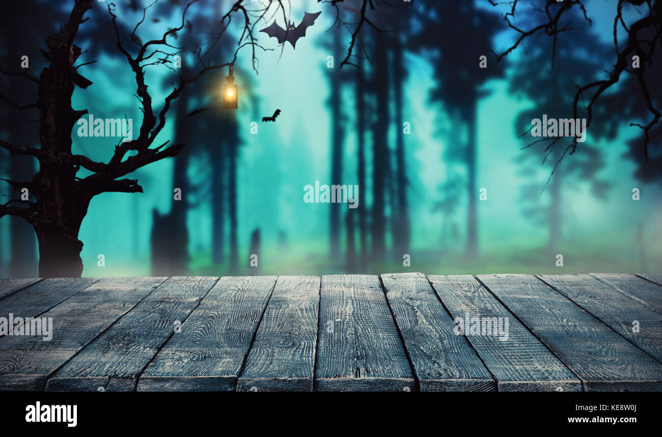 Spooky halloween background with empty wooden planks, dark horror background. Celebration theme, copyspace for text. Ideal for product placement Stock Photo