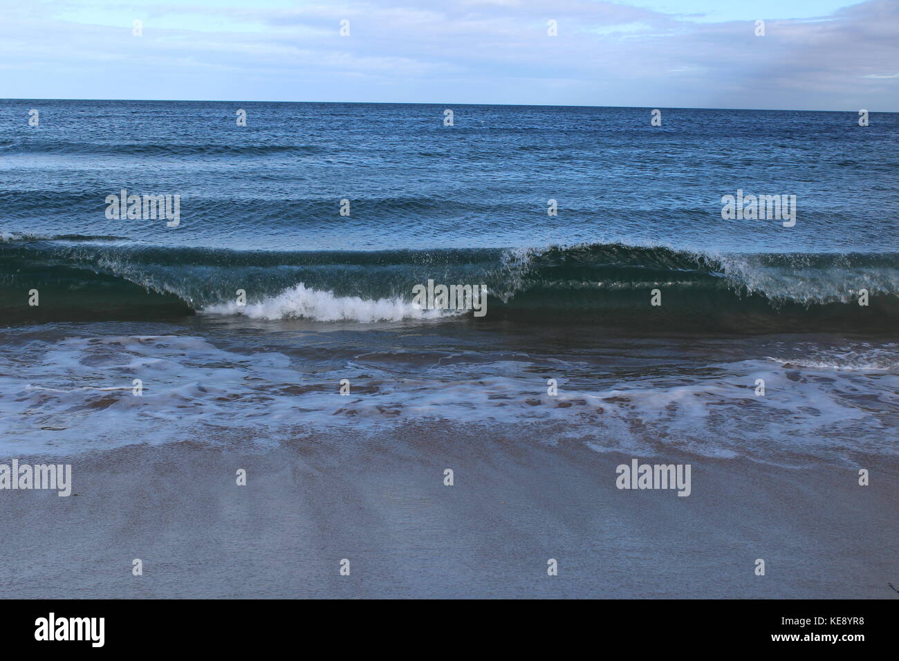 Roling waves ,Beadnell Beach Stock Photo