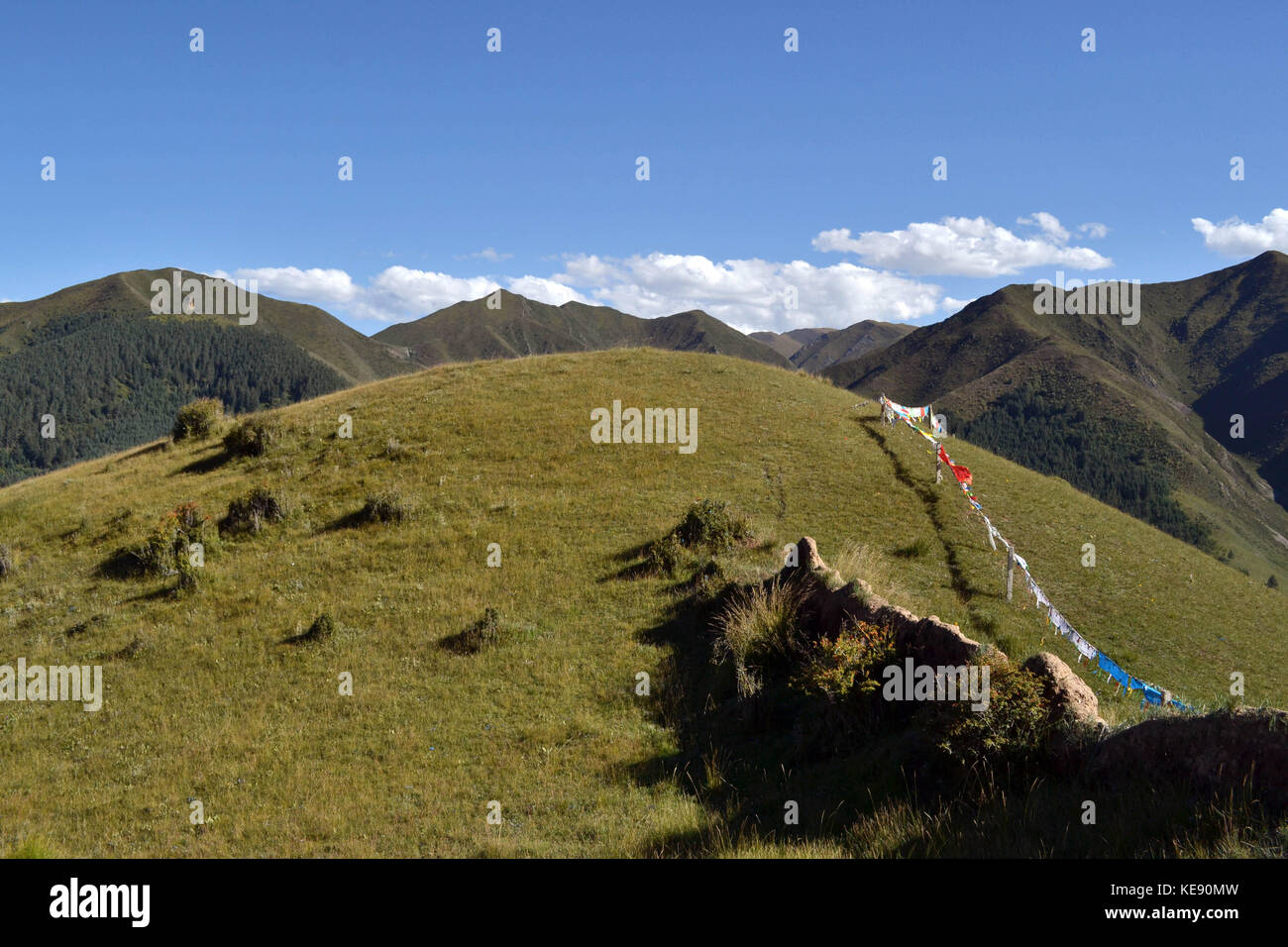 The prayer flags around the mountain behind Labrang or Xiahe, in Amdo ...