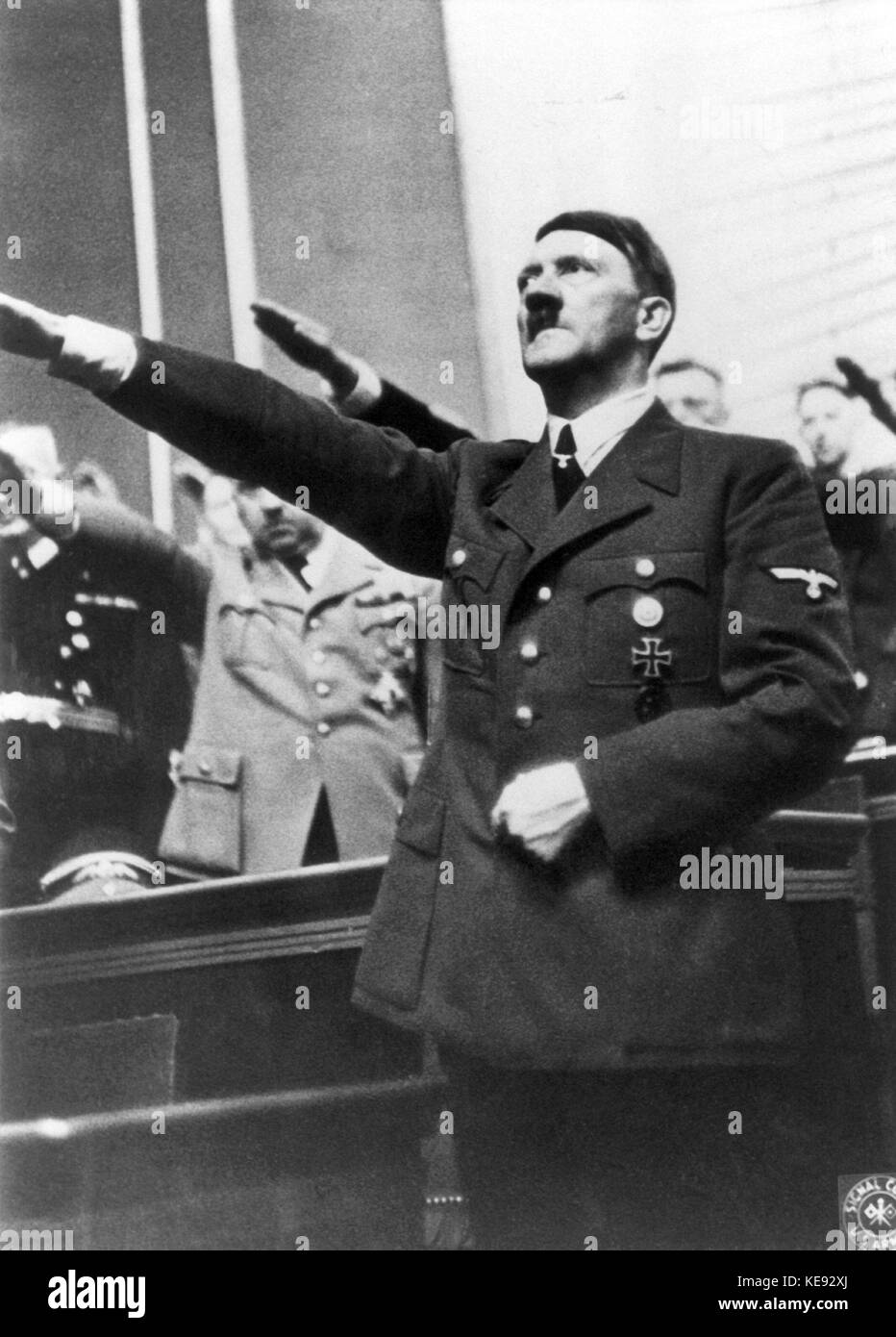The Reich Chancellor and National Socialist leader Adolf Hitler shows Hitlergruß in the Berlin Reichstag during the Second World War. | usage worldwide Stock Photo