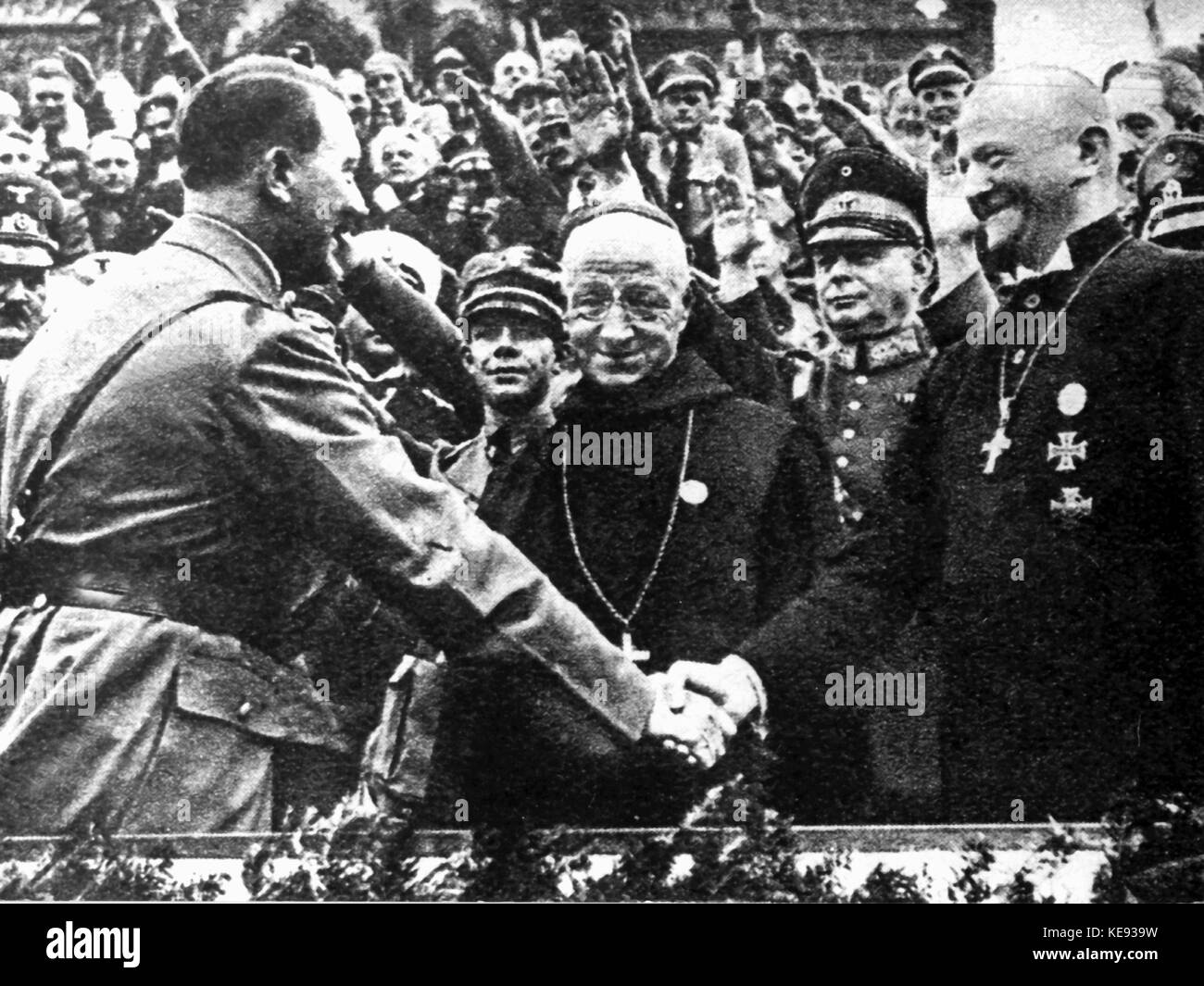 Adolf Hitler (l) greets Nuremberg bishop Ludwig Müller (r) during the Nuremberg rally of the NSDAP in 1934. | usage worldwide Stock Photo