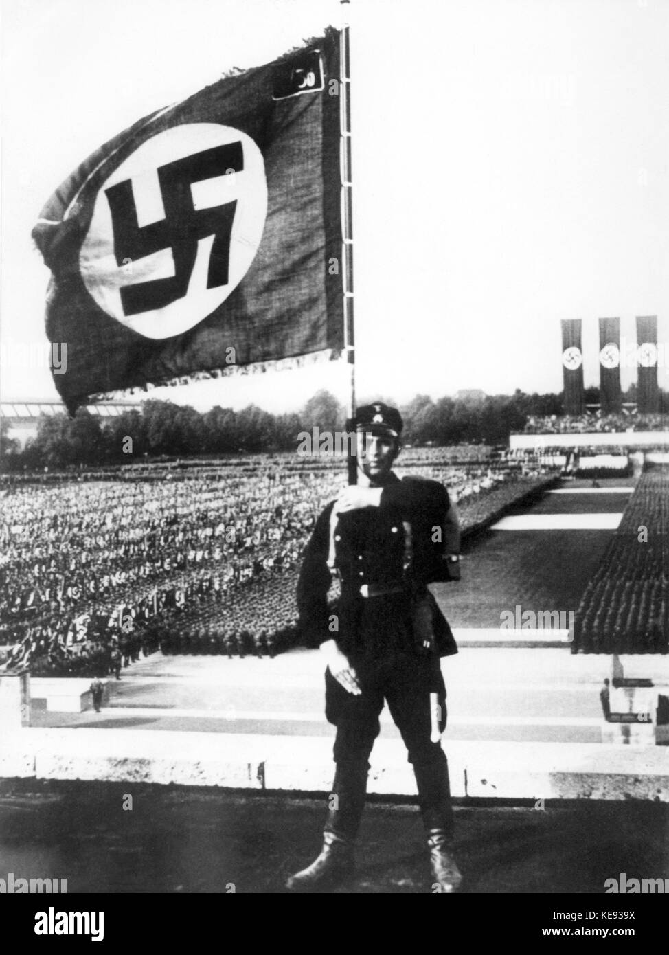 A soldier with a swastika flag during the honouring of the dead on the occasion of the Nuremberg Rally of the NSDAP in Nuremberg in September 1933.  +++(c) dpa - Report+++ | usage worldwide Stock Photo