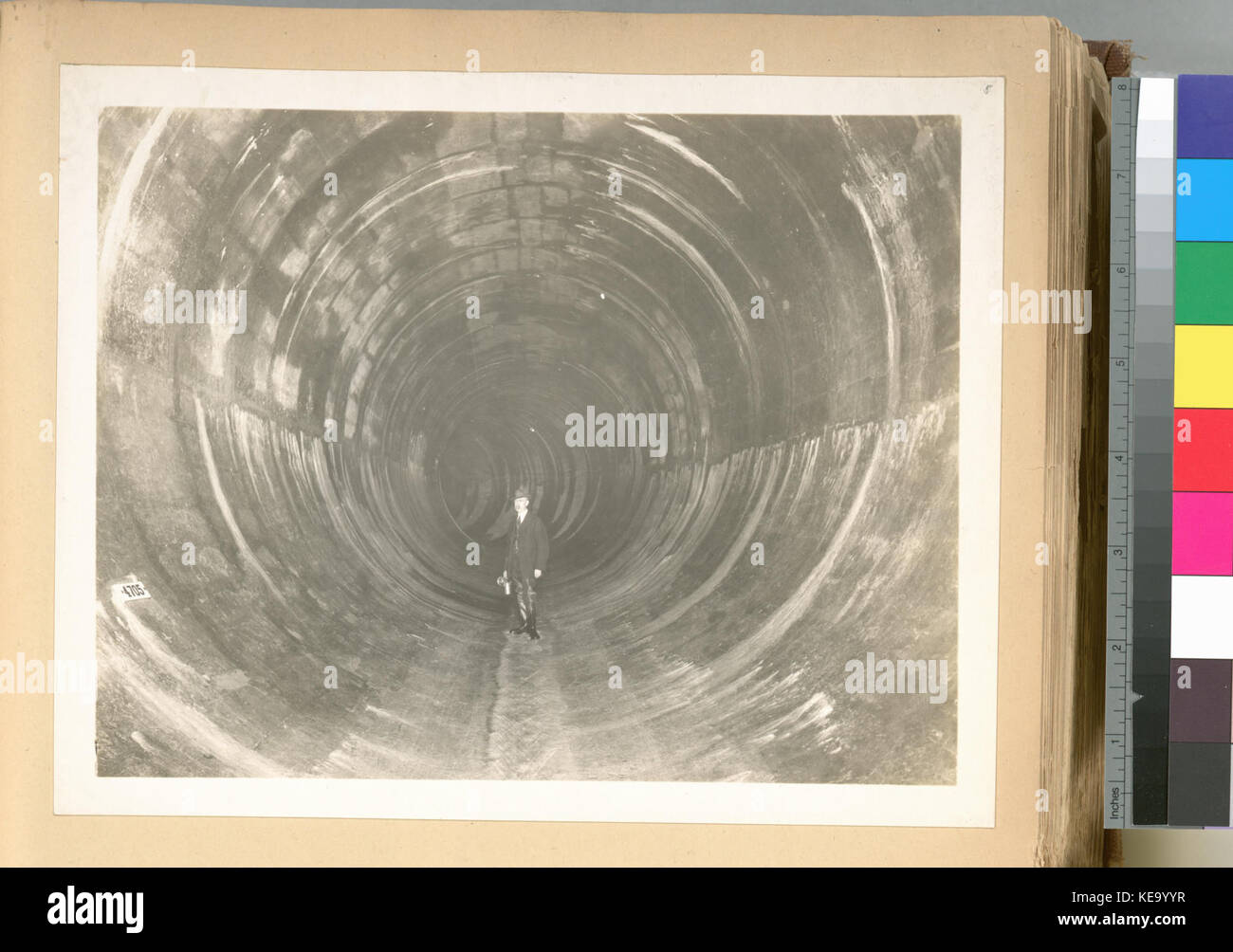 Yonkers pressure tunnel. Completed section of standard circular type of tunnel 16 feet 7 inches in diameter. Station marking tile on left. Contract 54. November 21, 1913 (NYPL b13814376 435484) Stock Photo