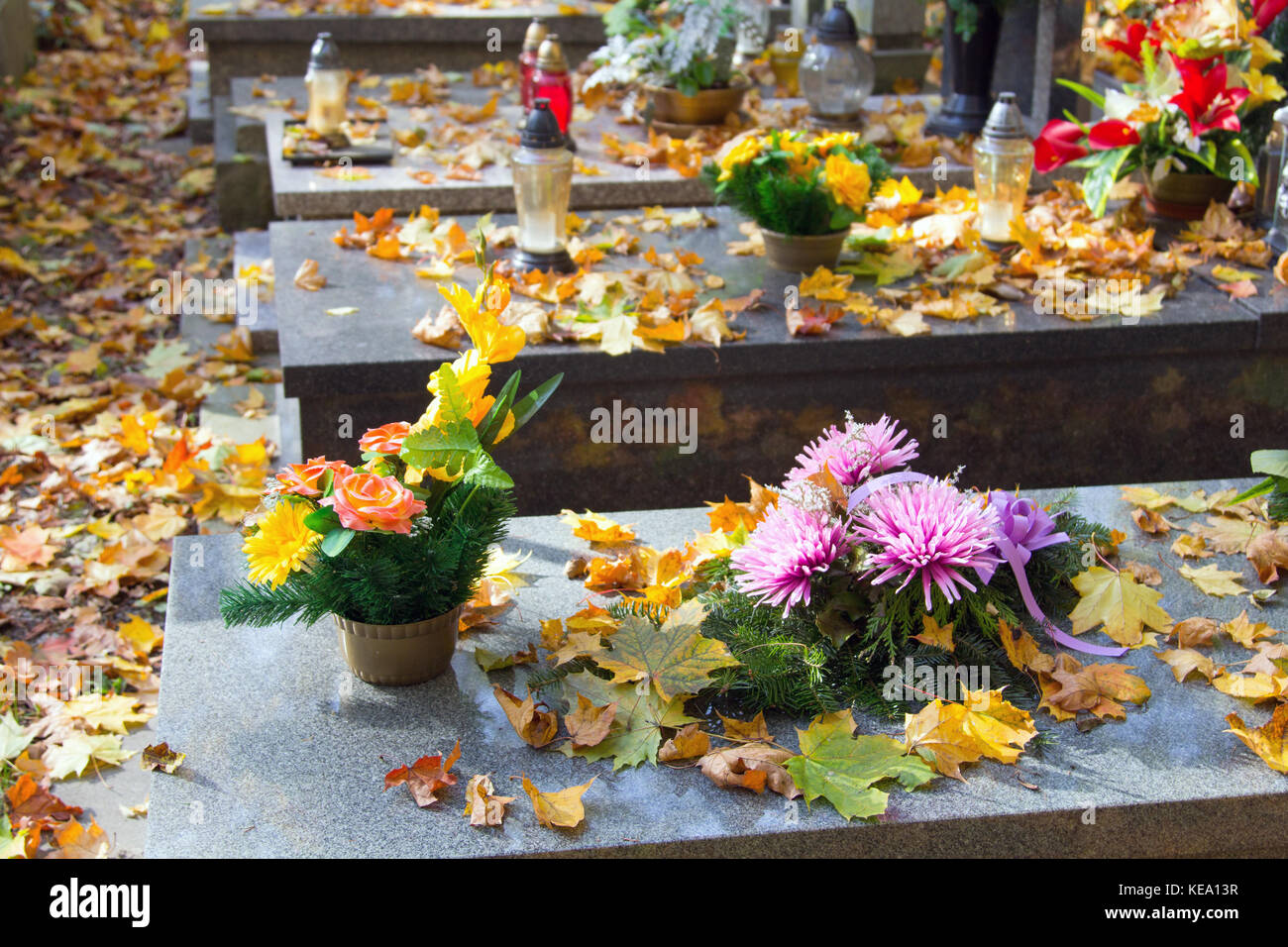 Graves Decorations Flowers And Votive Candles All Saints Day