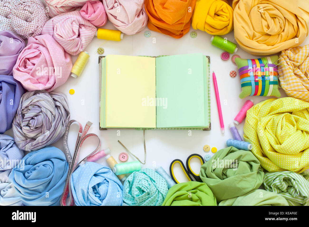 Accessories for sewing lie on a white background. Measuring tape ...