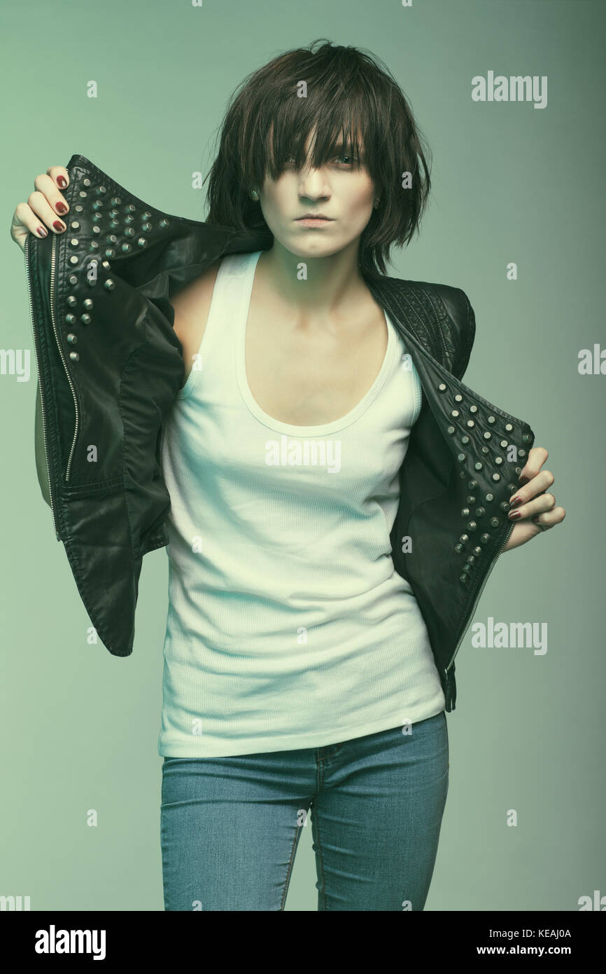 Androgyny female model in Heroin chic style. Old style tinted image Stock Photo