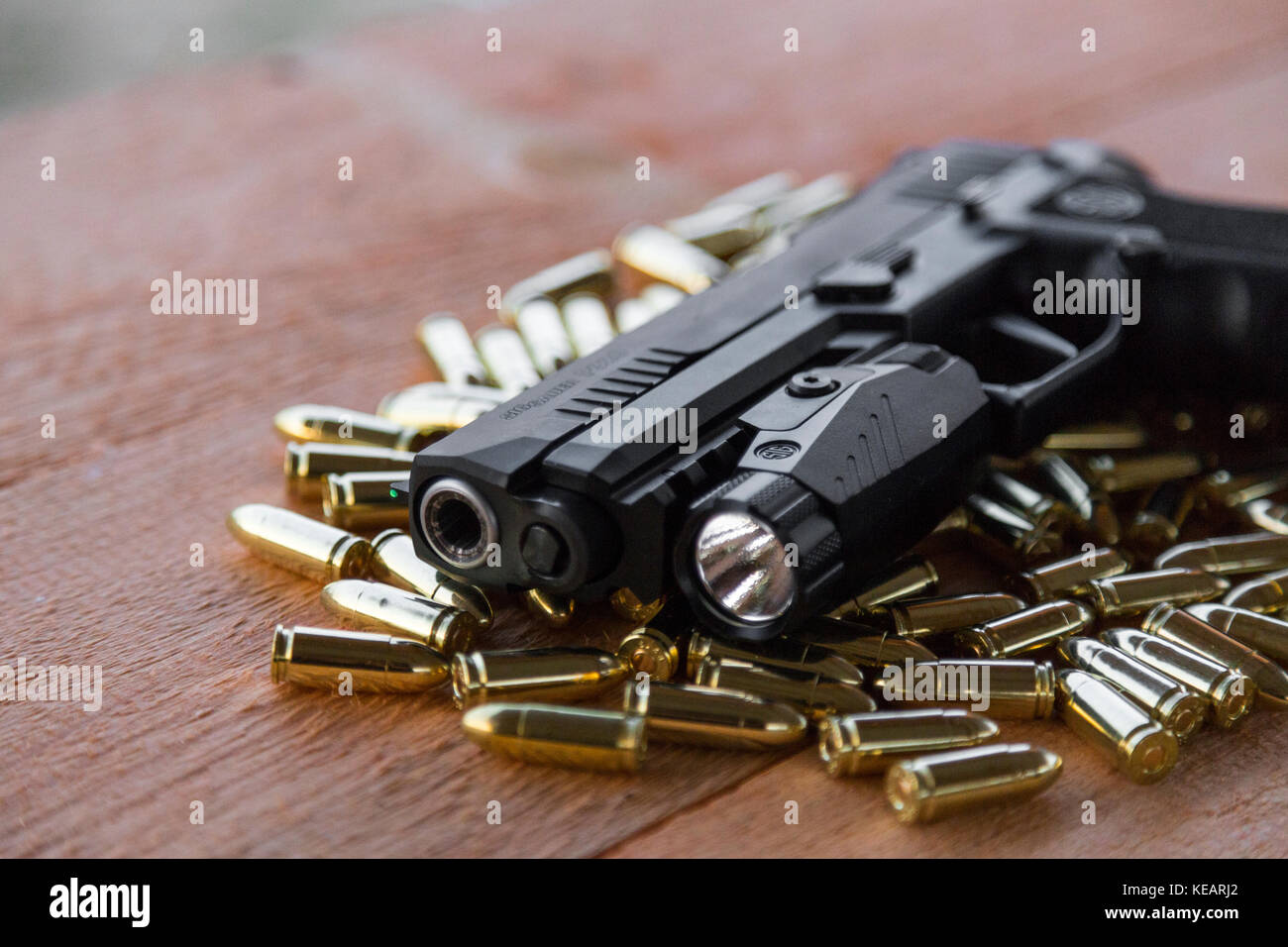 Pistol SigSauer P320 XFive & flashlight Foxtrot 1 Stock Photo