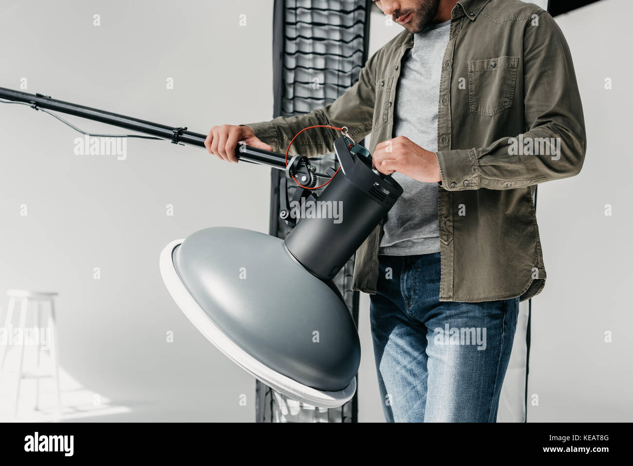 photographer with lighting equipment Stock Photo Alamy