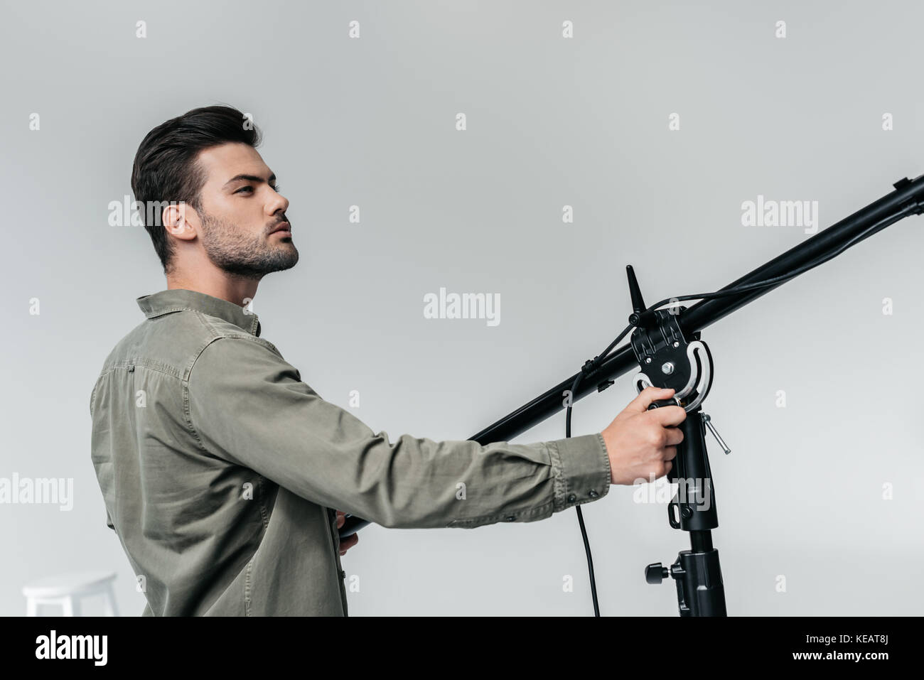 photographer with lighting equipment Stock Photo Alamy