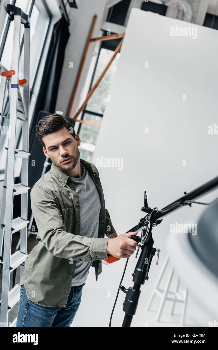 male photographer with lighting equipment Stock Photo Alamy